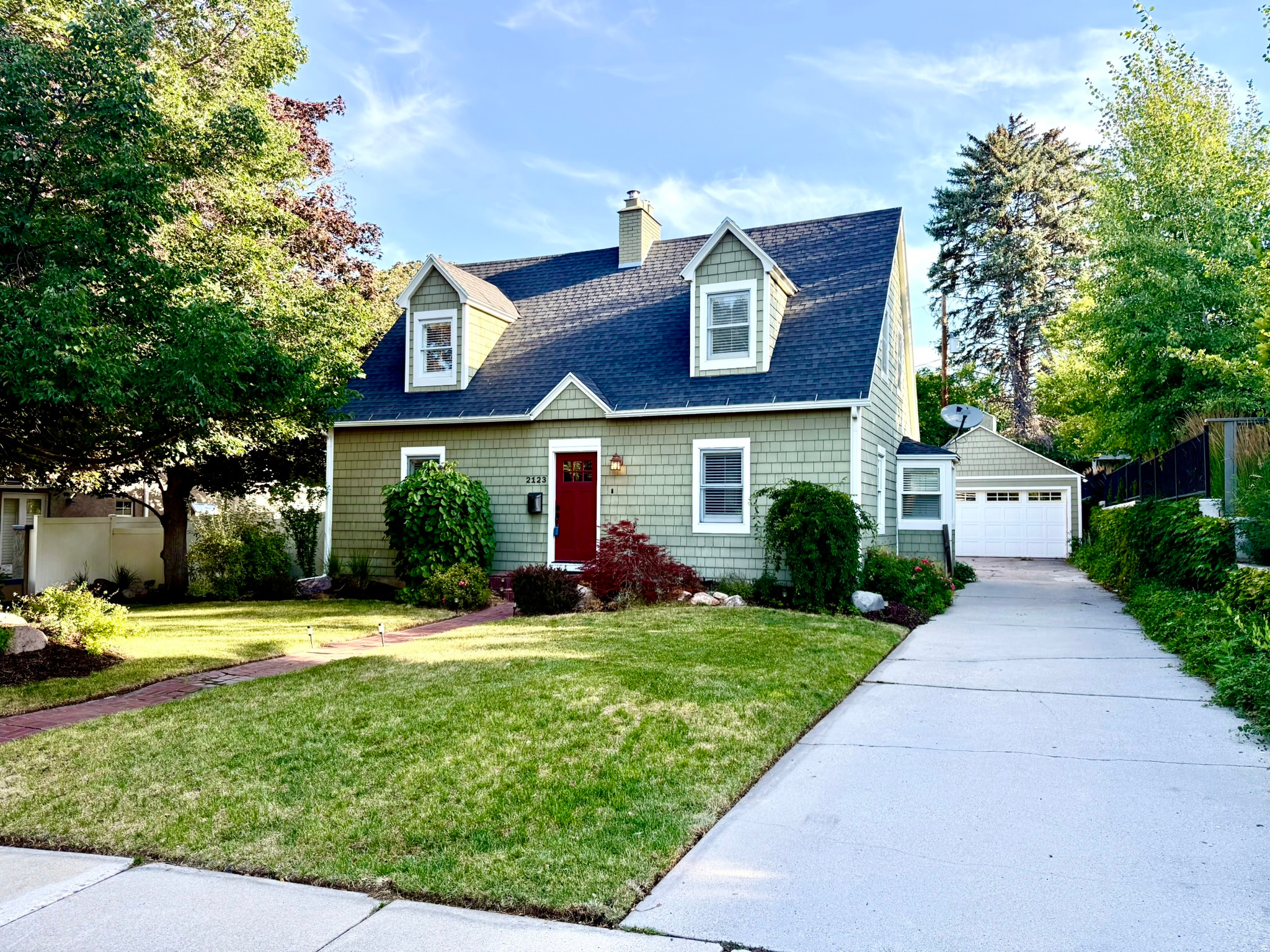 Originally built in 1939, this beautifully maintained Cape Cod-style home seamlessly blends timeless architecture with thoughtful modern updates. Nestled on a quiet, tree-lined street in one of Salt Lake City's most desirable Foothill neighborhoods, the home offers 2,318 square feet, 3 bedrooms, and 2.5 bathrooms, combining enduring craftsmanship with contemporary comfort just minutes from the University of Utah, Research Park, the Zoo, Foothill Village, downtown Salt Lake City, Emigration Canyon, and world-class outdoor recreation.  From the moment you arrive, the inviting curb appeal, mature landscaping, and welcoming front entry create an immediate sense of home. Inside, rich hardwood floors, elegant millwork, and classic architectural details showcase the quality and character of the home's original design, while thoughtfully proportioned rooms provide comfortable, functional living.  The spacious living room is anchored by a beautiful fireplace, creating an inviting gathering space for relaxing evenings or entertaining guests. A formal dining room flows seamlessly into the remodeled kitchen, where honed marble countertops, stainless steel appliances, and a gas range combine refined finishes with everyday functionality.   The flexible floor plan includes a comfortable basement family room with a 2nd fireplace, offering additional space for movie nights, a media room, home office, play area or an extra Guest room with it's own bathroom. Upstairs, the private primary suite features vaulted ceilings and generous proportions, while two additional bedrooms provide comfortable accommodation for family, guests, or work-from-home flexibility.