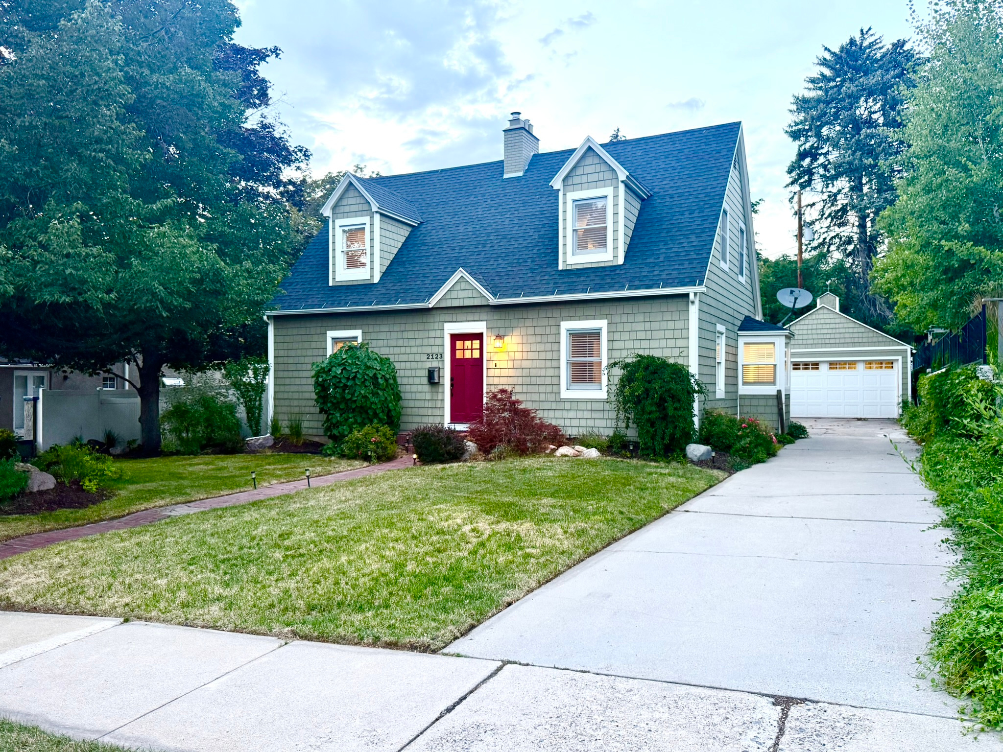 Originally built in 1939, this beautifully maintained Cape Cod-style home seamlessly blends timeless architecture with thoughtful modern updates. Nestled on a quiet, tree-lined street in one of Salt Lake City's most desirable Foothill neighborhoods, the home offers 2,318 square feet, 3 bedrooms, and 2.5 bathrooms, combining enduring craftsmanship with contemporary comfort just minutes from the University of Utah, Research Park, the Zoo, Foothill Village, downtown Salt Lake City, Emigration Canyon, and world-class outdoor recreation.  From the moment you arrive, the inviting curb appeal, mature landscaping, and welcoming front entry create an immediate sense of home. Inside, rich hardwood floors, elegant millwork, and classic architectural details showcase the quality and character of the home's original design, while thoughtfully proportioned rooms provide comfortable, functional living.  The spacious living room is anchored by a beautiful fireplace, creating an inviting gathering space for relaxing evenings or entertaining guests. A formal dining room flows seamlessly into the remodeled kitchen, where honed marble countertops, stainless steel appliances, and a gas range combine refined finishes with everyday functionality.   The flexible floor plan includes a comfortable basement family room with a 2nd fireplace, offering additional space for movie nights, a media room, home office, play area or an extra Guest room with it's own bathroom. Upstairs, the private primary suite features vaulted ceilings and generous proportions, while two additional bedrooms provide comfortable accommodation for family, guests, or work-from-home flexibility.