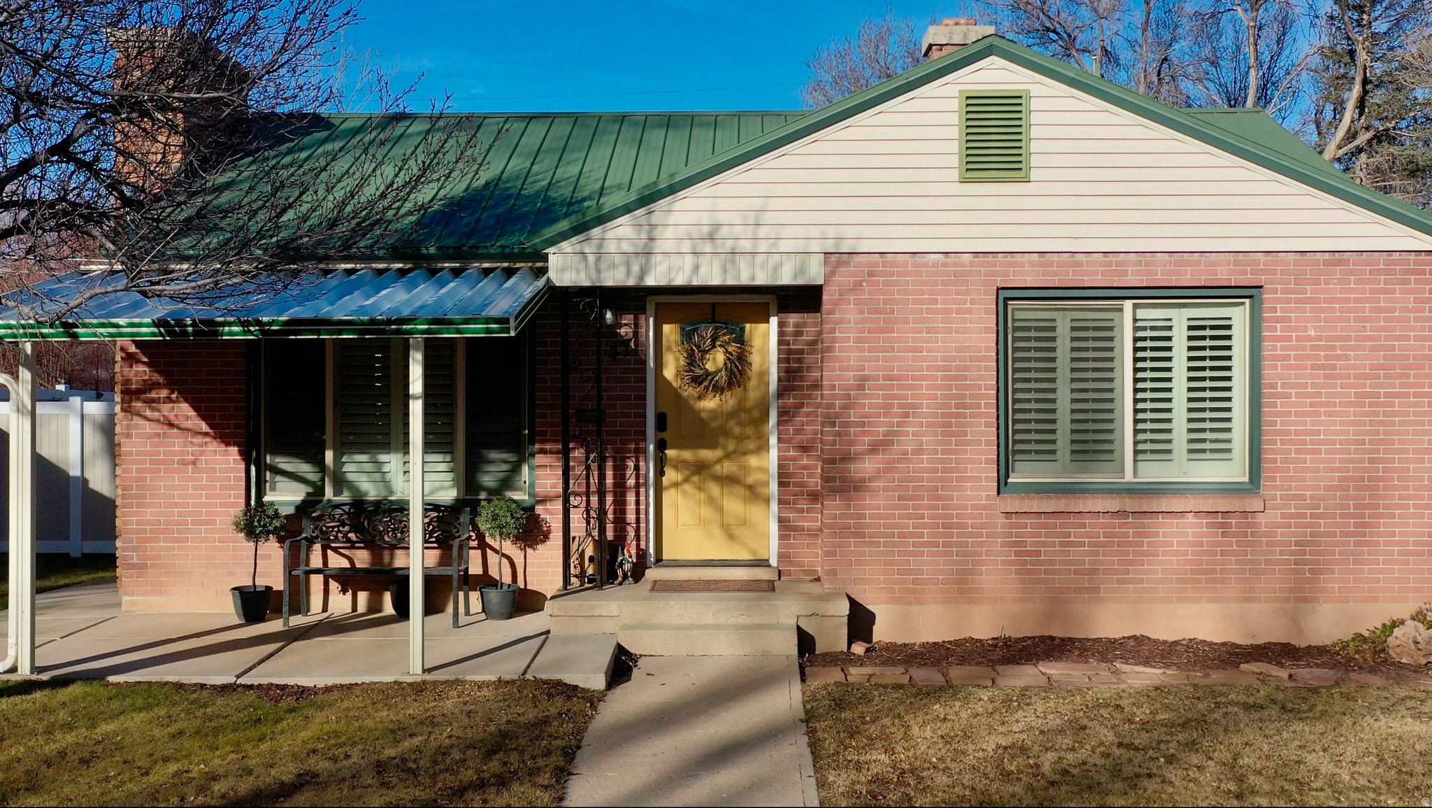 Adorable remodeled 1950's brick bungalow full of character! This 4 bed, 2 bath home features a finished basement and thoughtful updates throughout, fresh paint, updated plumbing and electrical, new basement carpet, new toilets, repaired windows and screens, newer kitchen appliances. Retreat to a fully fenced back yard, with gates on either side, and extended fencing. Perfect for relaxing or entertaining. Just minutes from SUU and Main Street. All the hard work has been completed. Move-in Ready.