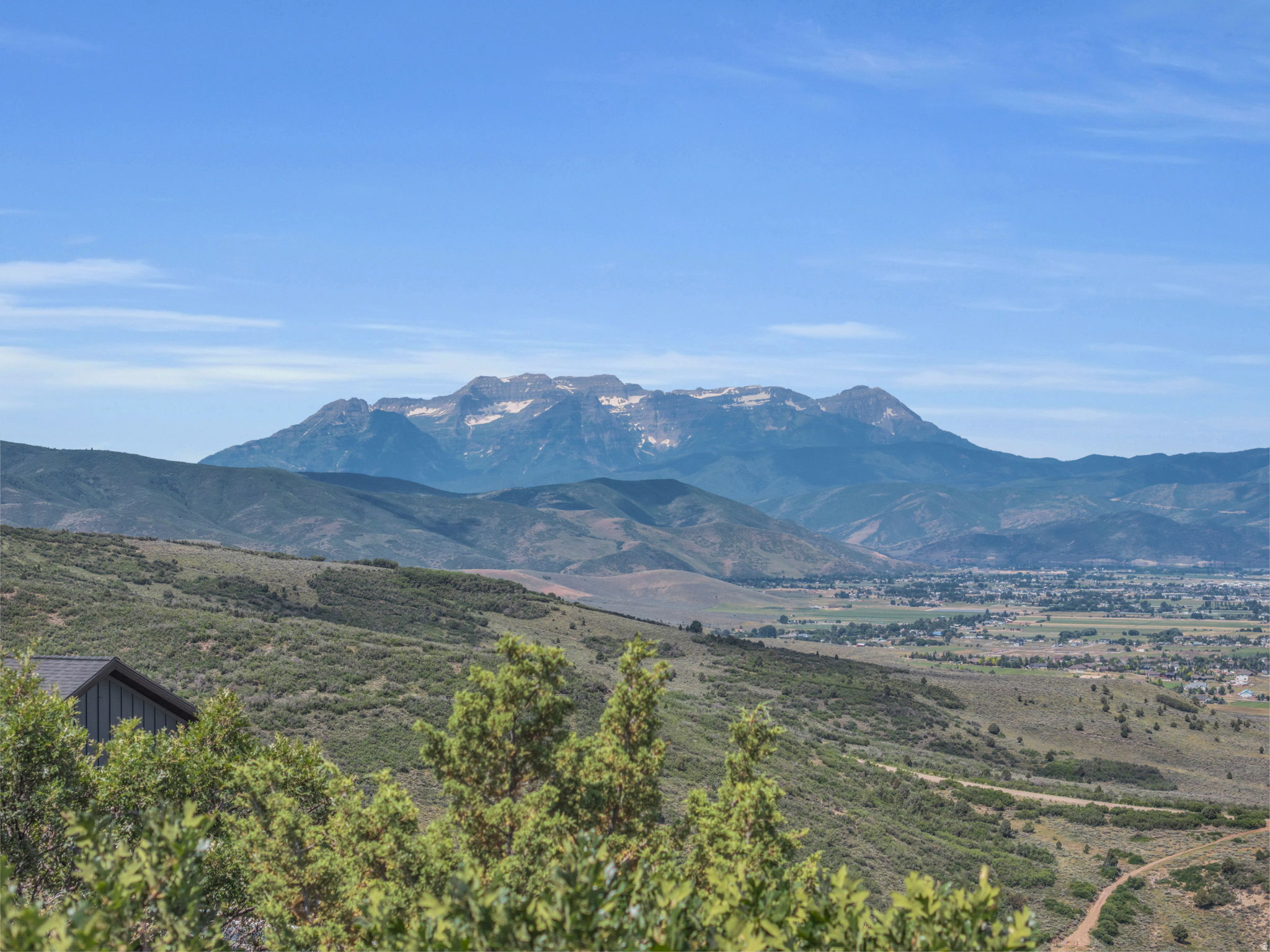 If you've been hunting for the perfect lot for your future family legacy mountain home, then look no further. This gently sloped uphill lot features unobstructed 180 degree views of Timpanogos, the top of Snowbird, and the entire Heber Valley. Water, power, and high speed internet are available and a four bedroom septic system was just approved by the county for this property, saving you money and time in designing your mountain home. This lot is located within Timberlakes, a private gated neighborhood with year round road access, several common areas with ponds and hiking trails, and access to spectacular snowmobiling in the High Uinta Mountains.