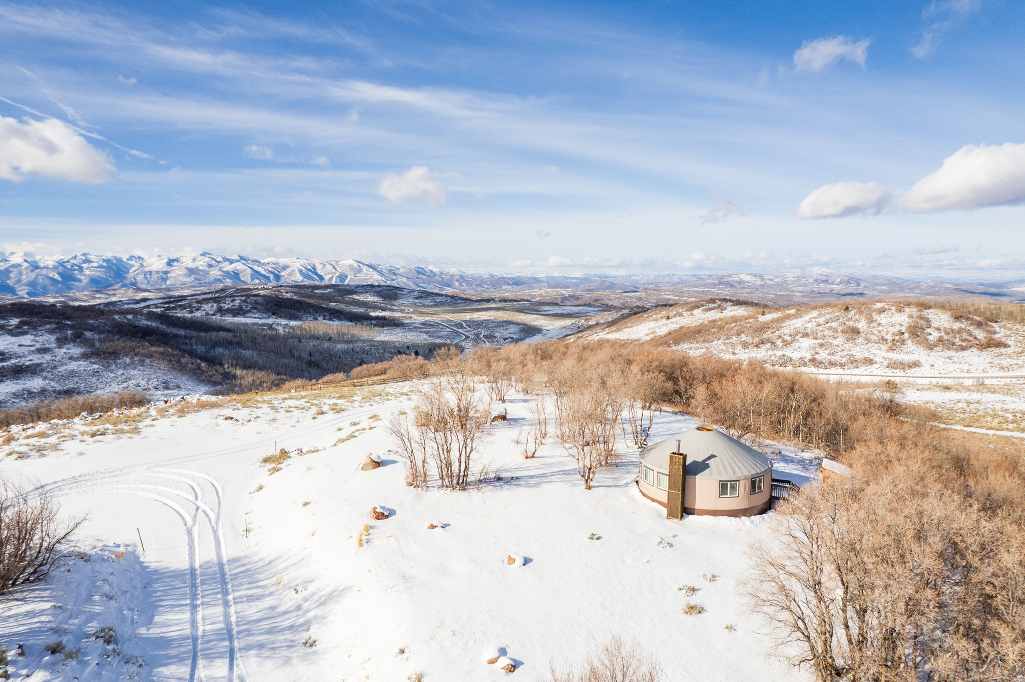 Escape to The Forest Creek Yurt. Your private weekend sanctuary where mountain dreams take root. The only property available with a luxurious yurt already in place, perfectly positioned for breathtaking views of Mt. Timpanogos, the Heber Valley, and Deer Creek Reservoir.    Enjoy the ultimate glamping retreat with a full kitchen, wood-burning stove, bedroom, loft, and bath - everything you need for effortless weekends in nature. Spend time here, and you'll quickly fall in love with the quiet beauty and unmatched lifestyle of Wolf Creek Ranch.  With the driveway and all utilities already installed, you'll be ready when it's time to build your main home, guesthouse, and barn (three structures allowed per lot).   Set on 14,000 private acres with 60 miles of trails, private trout ponds, the Provo River, and equestrian facilities, Wolf Creek Ranch offers adventure by day and serenity by night - the perfect place to build your legacy.