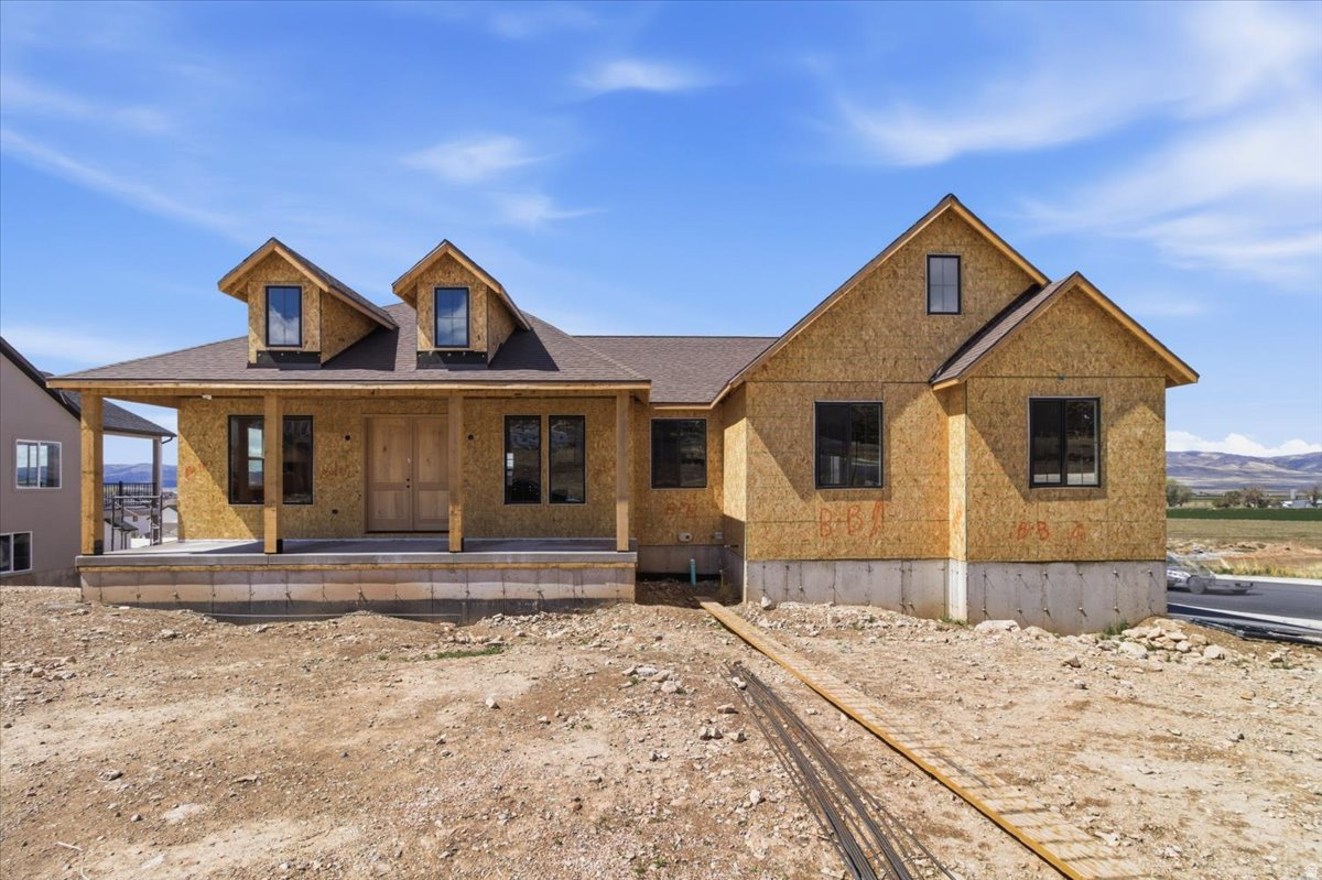 Beautiful modern farmhouse on a desirable corner lot offering 3 bedrooms, 2 bathrooms, and 3,300 sq ft of thoughtfully designed living space. Built by a proven builder known for quality craftsmanship and attention to detail. Open-concept floor plan with abundant natural light and stylish finishes throughout. The kitchen features custom cabinetry, quartz countertops, and all appliances included. Spacious living and dining areas provide an ideal layout for everyday living and entertaining. Primary suite offers comfort and functionality, while additional bedrooms provide flexibility for family, guests, or office space. Enjoy outdoor living with a covered deck off the main level and a covered patio at the walkout basement. The unfinished walkout basement allows for future expansion to suit your needs. Additional highlights include a tankless on-demand water heater. Estimated completion date: June 1, 2026.