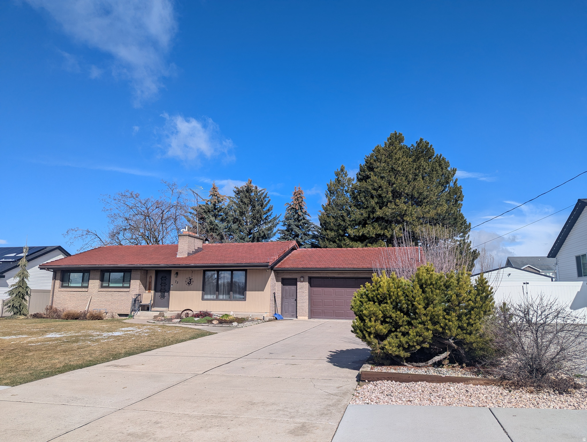 One of a kind, custom built in 1957 when they built to last! Exterior is brick & vinyl with clay tile roof. Full finished basement.   New windows, remodeled kitchen, new water heater, & new furnace.  Main level has 3 bedrooms, 1 bathroom, living room with fireplace, huge family room with wood burning stove. Home has central air and central vacuum.   Basement is fully finished with 2 bedrooms (1 with a fireplace), family room, 3/4 bathroom, lots of storage, accessible root cellar/cold storage, & laundry.  Enjoy the large .38 acre lot with mature trees & landscaping, large garden plot, fruit trees, secondary water, automatic sprinkler system, 2 car garage & large outbuilding.