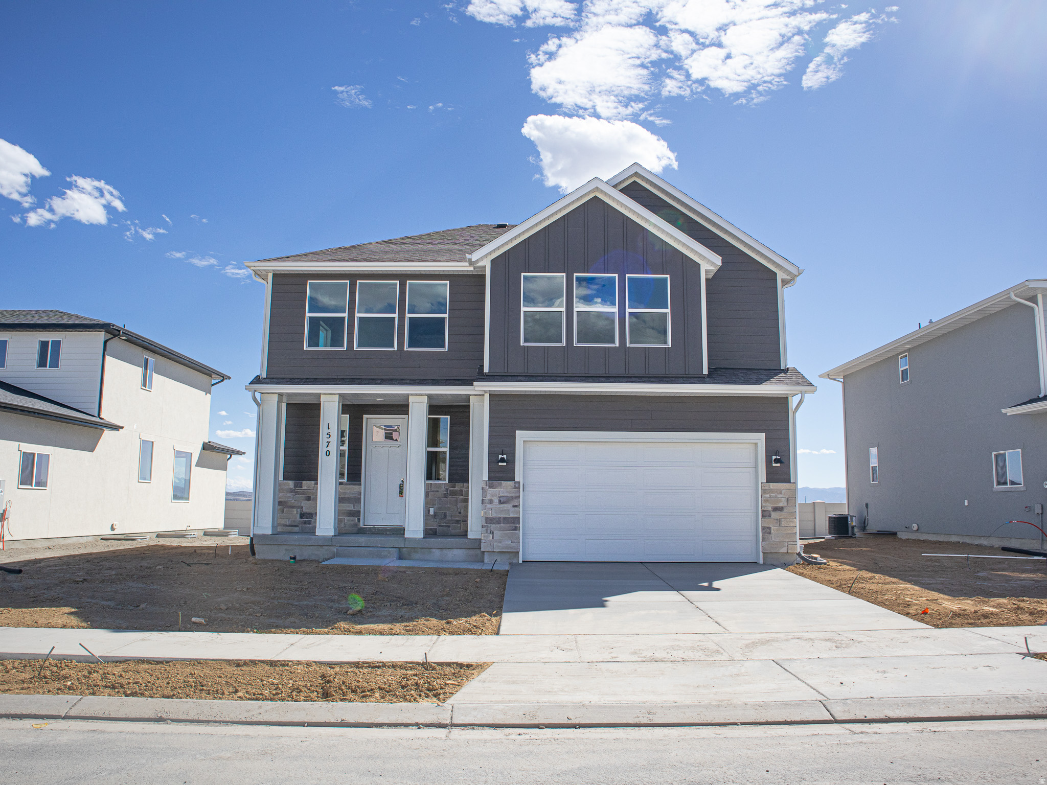 INTEREST RATES STARTING AS LOW AS 4.99% with our preferred lender or AMAZING $20,000 INCENTIVE TOWARDS CLOSING COSTS, RATE BUYDOWN, OR PRICE REDUCTION REGARDLESS OF LENDER! (Talk to agent for conditions). Must-see Parkway Fields Community in Eagle Mountain! Move-in ready! This beautiful home built by Flagship Homes features 4 bedrooms, 2.5 bathrooms, quartz slab countertops, painted cabinets, laminate flooring on the main level, a large loft on the 2nd floor, landscaped front yard, 2 car garage, decorative concrete wall on rear boundary and backyard (can be landscaped for an additional charge). The primary bedroom has a vaulted ceiling, large walk-in closet, and dual sinks with a separate tub and a double shower. With an unfinished basement, this home provides space for storage and room to grow. (If preferred, basement can be finished for an additional charge.) Call for more information or stop by our model home at 1546 E. Starling Lane, Eagle Mountain for a tour. Model home hours: Monday-Saturday 11 AM - 6 PM. Buyers to verify all information. Square footage is from house plans. Show Inst: Call Agent/Appt