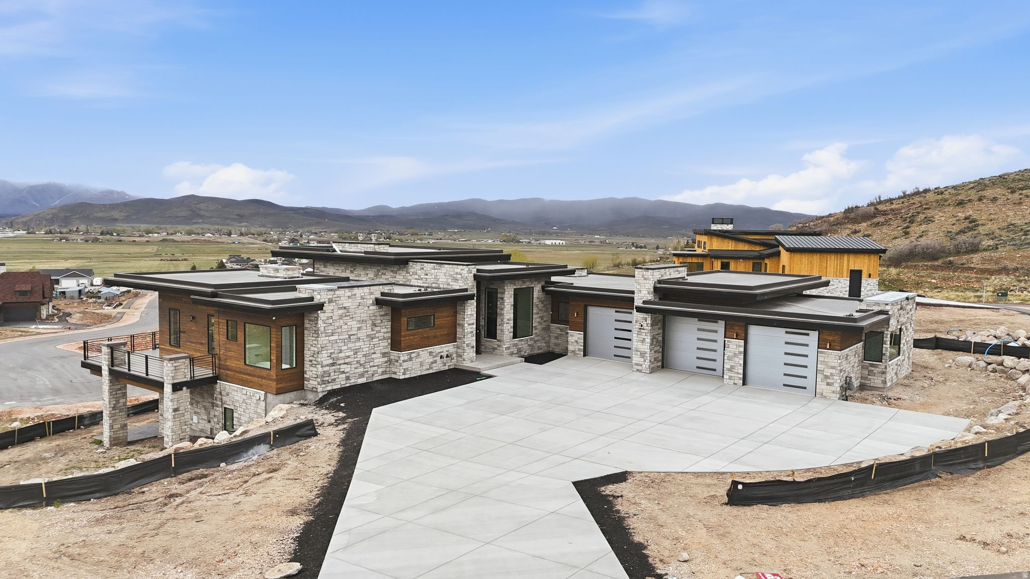 Be among the first to secure a home in this exclusive new enclave in the Foothills at Francis-where elevated design meets the natural beauty of the Kamas Valley. Ideally positioned on the hillside, this exceptional new construction captures sweeping, unobstructed views from Mount Timpanogos to Deer Valley and the surrounding ski resorts, all framed by dramatic walls of glass.  Thoughtfully designed for those who value both refined living and a connection to the outdoors, the home blends modern mountain architecture with expansive open spaces and abundant natural light. Nearly every room is oriented to maximize the views, creating a private, scenic backdrop that defines everyday living. High-quality craftsmanship and well-appointed finishes throughout reflect a commitment to timeless design and lasting value.  Located just minutes from Park City, Deer Valley's East Village, Jordanelle Reservoir, Heber City, and the town of Kamas, this home offers convenient access to world-class recreation while maintaining a sense of space and tranquility.  Opportunities in Foothills at Francis are limited-secure your place in one of Utah's most desirable and emerging lifestyle communities.