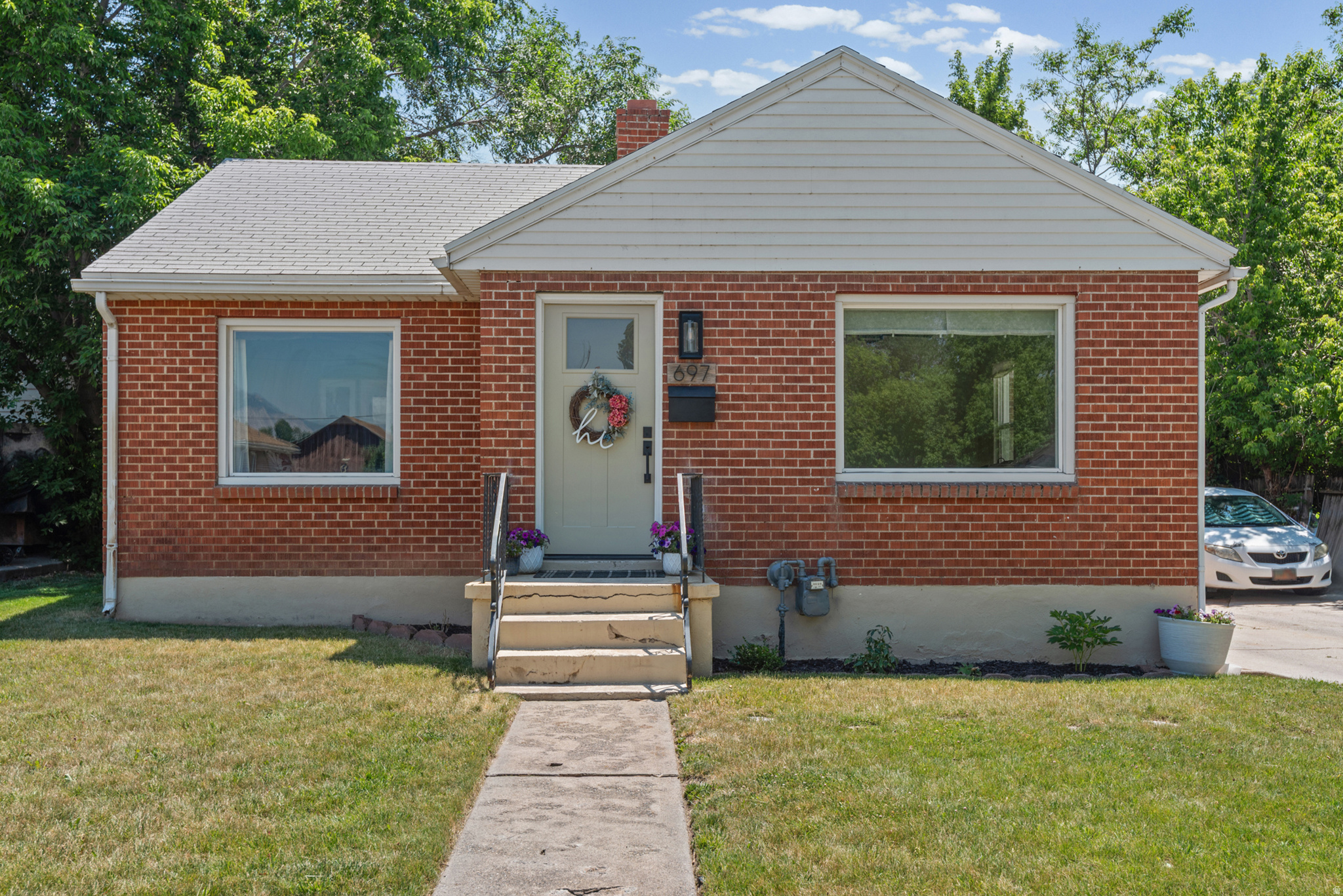 Darling South Ogden home you don't want to miss! This charming 4 bed 2 bath home with 2-car garage is updated and ready for its new owner. Highlights include new flooring, accent walls, crown molding, custom built-in storage & closet, updated kitchen, freshly painted cabinetry, & new main level light fixtures & ceiling fans. Whole home has been freshly painted. Large fully fenced yard with mature landscaping, flower beds, stone path & auto sprinklers in front. All on a quiet street with stunning mountain views. Minutes to Weber State, top schools, parks, hiking, mountain biking, downtown Ogden, Riverdale, McKay-Dee & Ogden Regional.