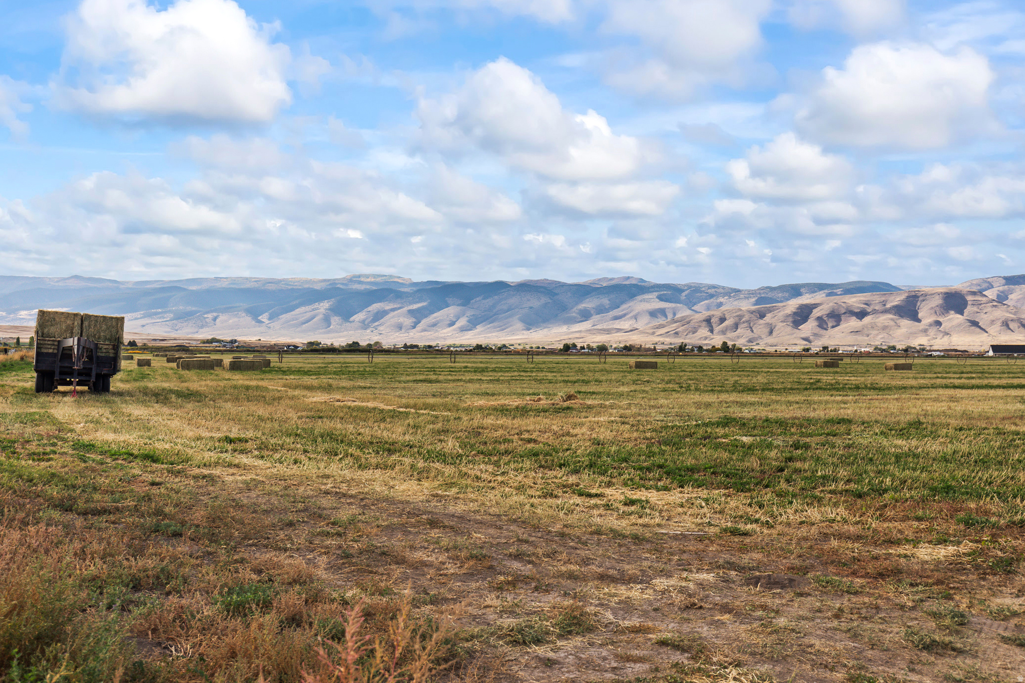Once-in-a-lifetime buildable lot with stunning mountain views just outside of Monroe! This productive 5-acre county parcel of farm land includes 2 shares of Monroe Irrigation Canal water, with additional shares or an underground water right that can be negotiated separately. Close to town for convenient access to schools and stores, yet completely private - it's the perfect location if you're looking to build your forever home with enough room for livestock and pasture. The land is ideal for crops such as alfalfa, pasture grass, or small grains, with a proven history of strong yields. And if you want even more land, there are two other larger contiguous parcels available to the north and west (see MLS# 2114518 for full 40 acres). Excellent accessibility from a well-maintained county road. Zoned for agriculture, but close to city limits for potential annexation opportunities in the future. Don't miss out! Buyer to verify all information.