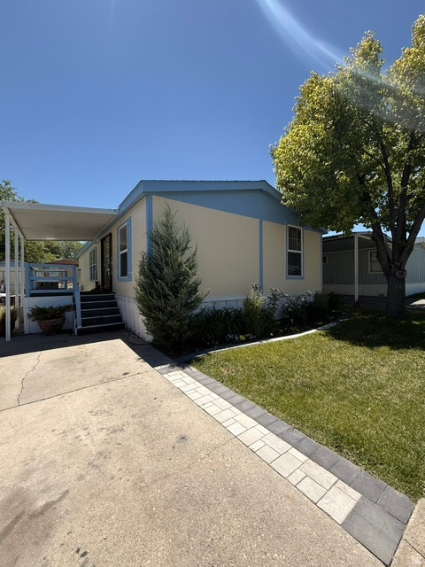 Built in 2006, this very well-maintained double-wide mobile home features fresh exterior paint (10/2025), a full sprinkler system with drip irrigation, a newly replaced exterior skirt, and recently replaced laminate flooring in two of the bedrooms.  The landscaped outdoor area includes a basketball hoop, a storage shed, and plenty of space to spend time outside.  The convenient park location presents a great opportunity for comfortable, low-maintenance living in the heart of West Jordan.  Square footage figures are provided as a courtesy estimate only and were obtained from MLS.  Buyer is advised to obtain an independent measurement.