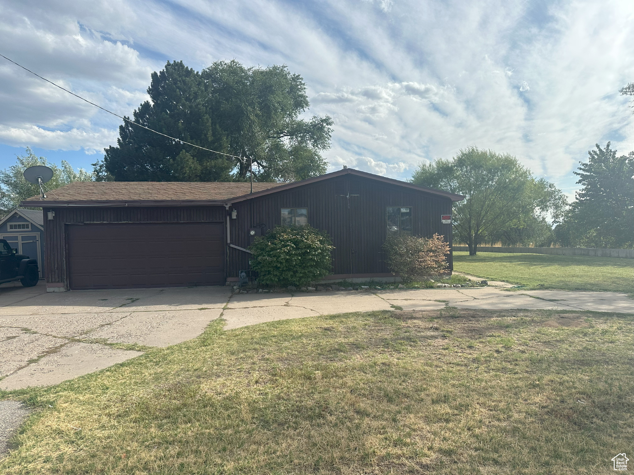 Discover the perfect blend of comfort and space with this 3-bedroom, 2-bath single-family home situated on 1.51 acres in beautiful Layton. With plenty of updates and room to grow, this property is full of potential.  The home features central heating and air (installed in 2012) for year-round comfort, along with durable LVP and hardwood flooring. Practical upgrades include a gas line added to the kitchen for a gas stove, new ABS waste lines replacing the original cast iron, and a newly built shed for extra storage.  Outdoors, you'll love the updated fencing, spacious yard, and a thoughtfully designed chicken run and coop-perfect for hobby gardening or simply enjoying the extra land. With over an acre and a half of space, the possibilities are endless-garden, workshop, outdoor entertaining, or even future expansion.  Enjoy the peace and space of country-style living while still being close to all that Layton has to offer-shopping, schools, parks, and easy highway access.  Don't miss this opportunity to make this versatile property your own. Schedule your showing today! *Home is To Be Sold in AS IS Condition* DEVELOPMENT POTENTIAL...contact agent for info.