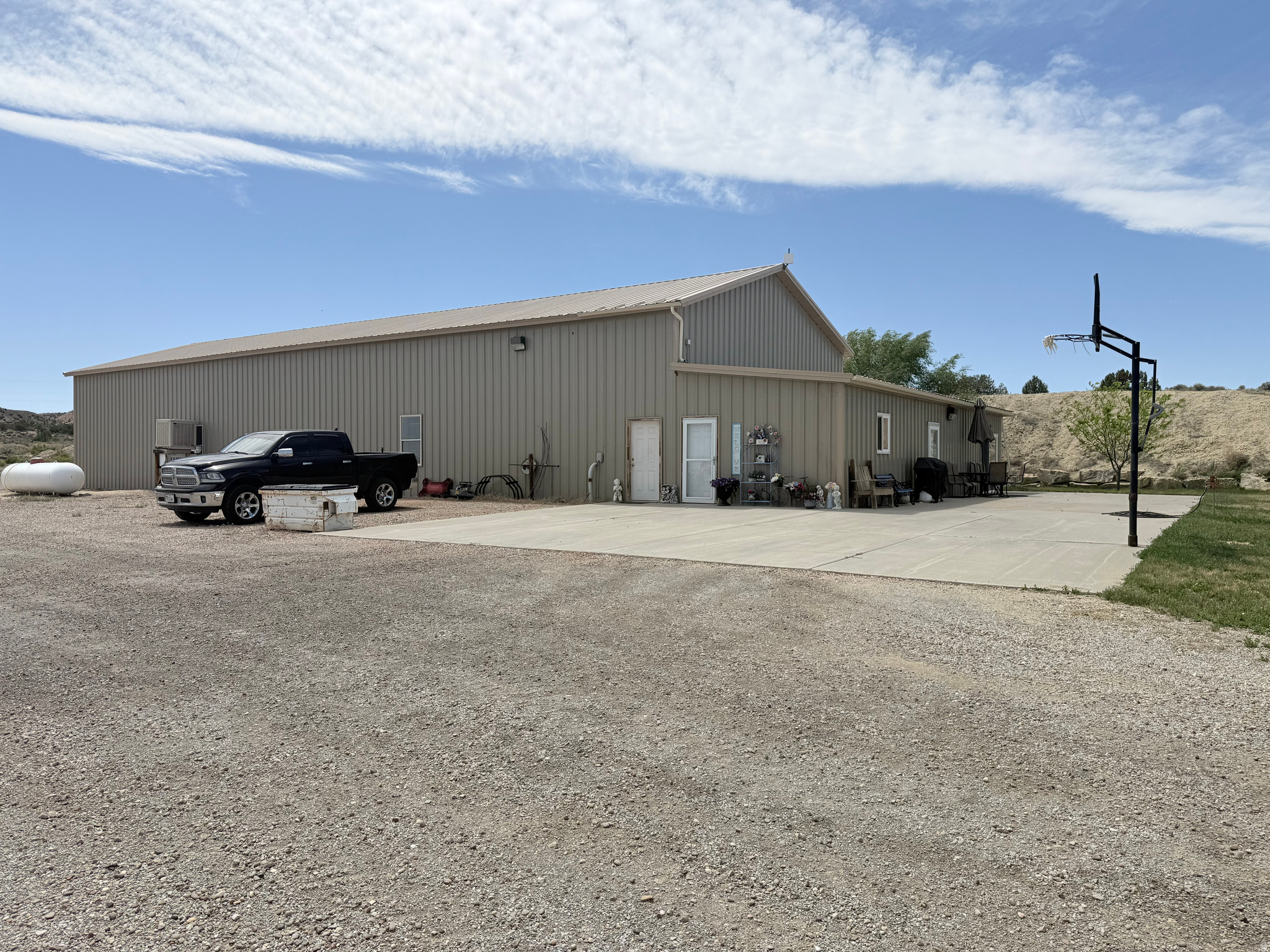 Exceptional commercial/industrial property located along the highly traveled Bonanza Highway with outstanding exposure and development potential. Situated on 30 acres, this versatile property offers a rare combination of residential living, large-scale shop space, and agricultural improvements, making it ideal for a variety of business or investment uses. The property was previously planned for future commercial development such as a truck stop, convenience store, or fuel station. Improvements include approximately 6,300 square feet combined, featuring a well-maintained 3-bedroom residence with a spacious primary bedroom and attractive Quakey wood cabinetry in the kitchen (2100 SF). The expansive 36'x150' shop is equipped with spray foam insulation, washer/dryer hookups, RV hookups, and two oversized 16'x14' overhead doors designed to accommodate large equipment or vehicles. A 40'x60' farm shed provides additional storage and functionality. Excellent opportunity for investors, business owners, or those seeking a live/work property with highway frontage and room to grow. Square footage figures are provided as a courtesy estimate only. Buyer is advised to obtain an independent measurement and verify all information.
