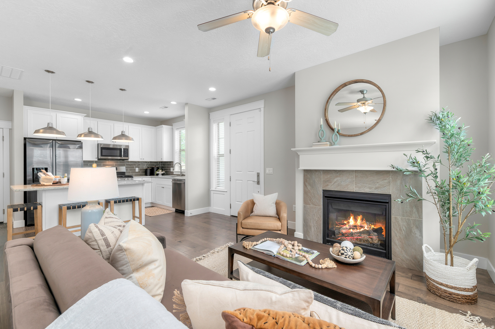 Grand Open House | Saturday, June 13th, 2026 | 11 - 1 pm. Welcome to effortless living in the heart of Sandy's highly desirable Red Sage community. Perfectly positioned in a quiet, private setting, this beautifully maintained townhome offers the ideal blend of comfort, convenience, and modern style.  Step inside to discover a bright and inviting open-concept floor plan designed for both everyday living and entertaining. The spacious living and dining areas flow seamlessly into the well-appointed kitchen, creating a warm and functional gathering space. Upstairs, you'll find three generous bedrooms, including a spacious primary suite featuring a private ensuite bathroom and ample closet space-your own peaceful retreat at the end of the day.  With 3 bedrooms, 2.5 bathrooms, and 1,679 square feet of thoughtfully designed living space, this home offers room to relax, work, and grow. The attached garage is already wired for an electric vehicle charger, providing added convenience for today's modern lifestyle. Enjoy low-maintenance living and access to outstanding community amenities including a clubhouse, fitness center, and sparkling pool.  Located just minutes from shopping, dining, entertainment, parks, world-class ski resorts, and convenient freeway access, this home places everything you need right at your fingertips. Whether you're commuting, exploring the outdoors, or enjoying a night out, you'll love the unmatched accessibility this location provides.  Move-in ready and nestled in one of Sandy's most sought-after communities, this is an exceptional opportunity to enjoy the perfect combination of lifestyle, location, and value.    Square footage figures are provided as a courtesy estimate only and were obtained from previous MLS.  Buyer is advised to obtain an independent measurement.