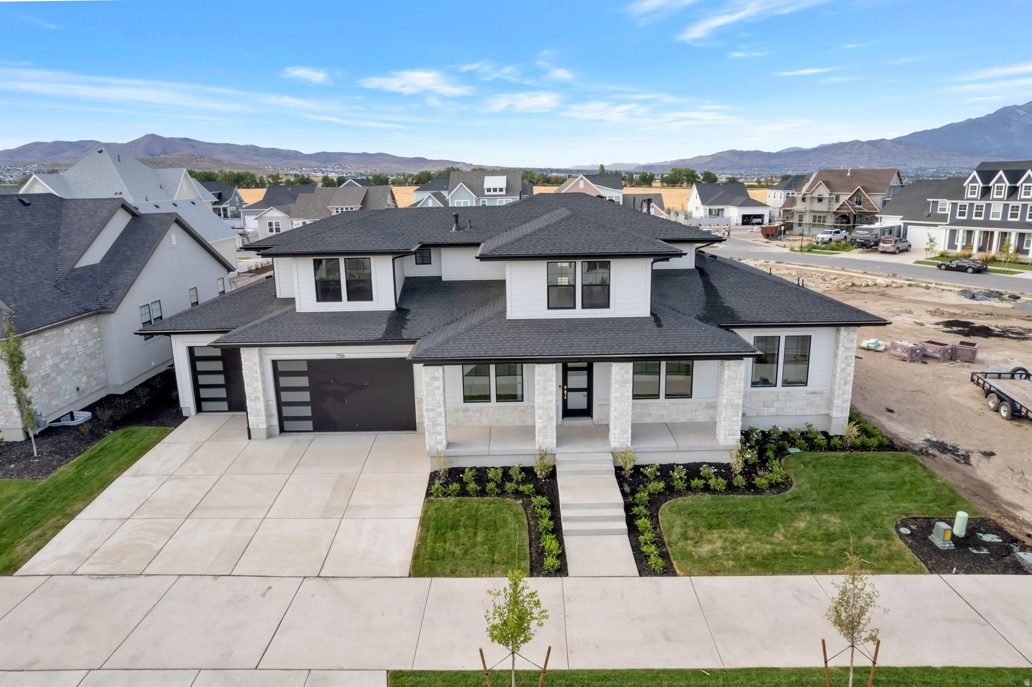 LOT#166 in Beacon Pointe by Symphony Homes. This STUNNING 'Browning XL' plan blends luxury with thoughtful design. Lots of upgrades and designer finishes throughout! The main floor features both a flex room (w/ French doors) and a formal living room with custom millwork and both have crown molding. Grand great room with two-story ceiling with wood beam grid ceiling. The gourmet kitchen has quality appliances including a 48" ZLine 8-burner dual fuel range with double ovens and a built-in refrigerator and freezer, a spacious butler's pantry with countertops and outlets, and a bright dining nook that opens to the covered patio. A custom mudroom bench and a large laundry room add everyday convenience. The expansive primary suite has a decorative ceiling and includes a large custom-finished wardrobe room with a window. Primary bathroom is a show-stopper with separated vanities plus a makeup counter, free-standing soaker tub, and 78x60 walk-in shower with a quartz bench. Upstairs has a loft open to below and a large bonus room. All bedrooms feature walk-in closets. The fully finished basement is built for entertaining with a media room, kitchenette, huge game room, and a gym with 3/4 bathroom (also accessed by adjacent bedroom). Garage is finished to paint and 3rd stall is 38' deep and 18' wide in the back for potential to park capacity of 4 vehicles. 9' foundation walls, an active radon system, and a cold cellar. A must-see!