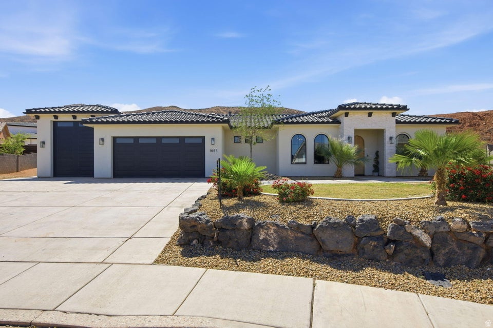 Stunning home in Scenic Sunrise at the end of a cul-de-sac with views, RV garage + parking, and no HOA! This thoughtfully designed property features a bright open layout with luxury vinyl plank flooring, white oak cabinetry, quartzite countertops, and a custom Venetian plaster hood as a true kitchen centerpiece. The kitchen offers a spacious walk-in pantry, designated dining area that leads to the back patio and large island for entertainment. Versatile front casita/salon space with its own entrance offers endless possibilities. Such as, home office, guest suite, or business use. The primary en-suite is complimented by a walk-in closet, walk-in shower, dual sinks and separate soaking tub. Spacious living areas flow seamlessly to the covered patio and backyard, with a retaining wall already in place and seller offering to coat the patio for the buyer if desired. Located in a welcoming neighborhood with community events and great neighbors, just minutes from shopping, dining, and walking distance to Horizon Elementary. Clean, modern, and move-in ready!