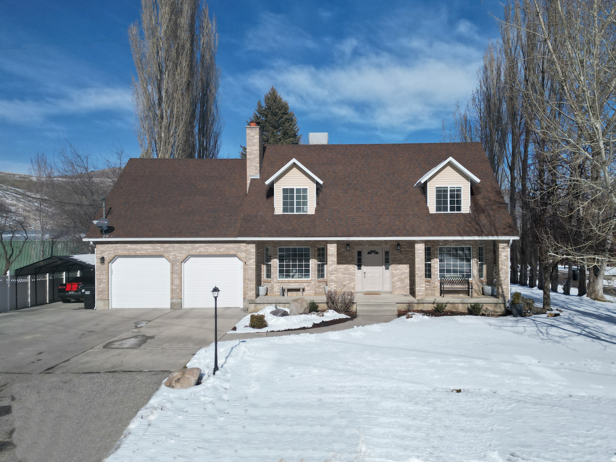 Welcome to this spacious, beautifully updated home in the heart of Mantua, perfect for those looking for room to spread out, live together, and enjoy mountain living. With 6 bedrooms, 3.5 bathrooms, and 4,140 square feet, this home offers flexible space for multi-generational living, working from home, or hosting guests. Recent updates include brand new flooring and baseboards, updated bathrooms, all new light fixtures and hardware, plus a brand-new fridge and dishwasher, making this home truly move-in ready. The main level is bright and welcoming, with great flow between the kitchen, dining, and living areas. Downstairs, the basement kitchenette creates the perfect setup for extended family, guests, or a cozy second living space. You'll also love the convenience of two laundry rooms with laundry equipment included, a central vacuum system, and an EV charger for hybrid or electric vehicles. Outside, enjoy a 2-car garage, RV parking, mature trees for privacy, and a covered deck with beautiful mountain views. Located in a quiet, close-knit community within walking distance of Mantua Reservoir, offering hiking, fishing, and boating, with easy access to Brigham City and Logan. If you've been looking for a home that offers space, comfort, and a lifestyle, not just a floor plan, this one is worth seeing in person.