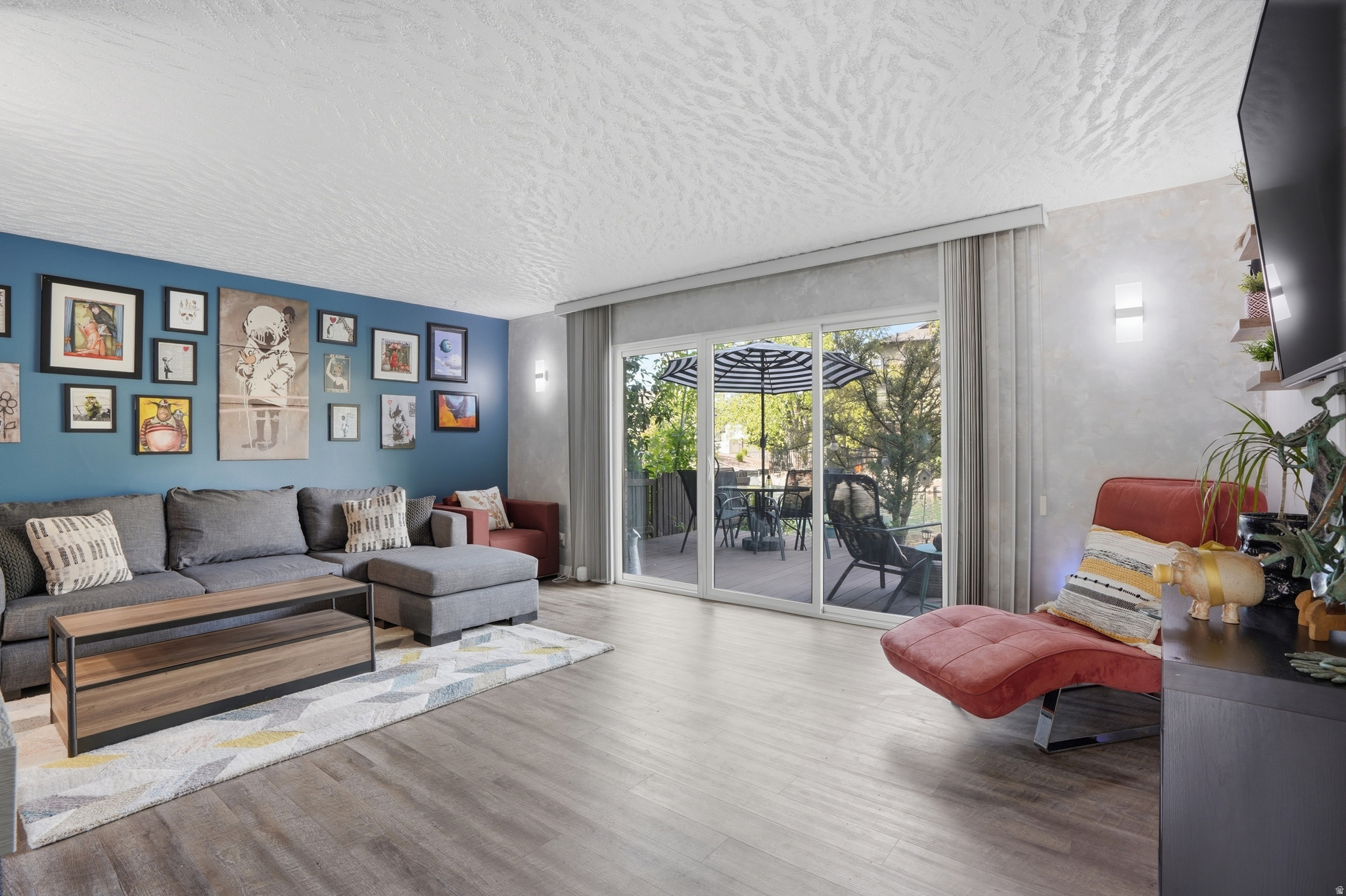 Welcome home to this beautifully remodeled and exceptionally rare main-level condo in the highly sought-after Hidden Lake community of Millcreek. From the moment you step inside, you'll feel the warmth and comfort of a home designed for easy, relaxed living. Start your mornings in the spacious owner's suite, where peaceful waterfront views, playful ducks, and graceful geese create a serene retreat right outside your window. The inviting family room features a cozy fireplace, perfect for quiet evenings, while the walkout patio offers the ideal place to unwind and enjoy the tranquil lake setting. This home also includes a private 1-car garage, an additional dedicated parking space, and a wheelchair-accessible ramp for added convenience. While located very central and conveniently, Hidden Lake truly feels like a private oasis, offering resort-style amenities including a swimming pool, spa, sauna, clubhouse, tennis courts, basketball court, and RV parking. Even better, the HOA covers gas, water, sewer, exterior insurance, exterior maintenance, grounds maintenance, garbage service, and snow removal-allowing you to spend more time enjoying life and less time worrying about upkeep.  If you've been searching for a peaceful, move-in-ready waterfront retreat with outstanding amenities and effortless living, this is the one. Measurements given as a courtesy. Buyer and Agent to verify all. Not FHA Approved.