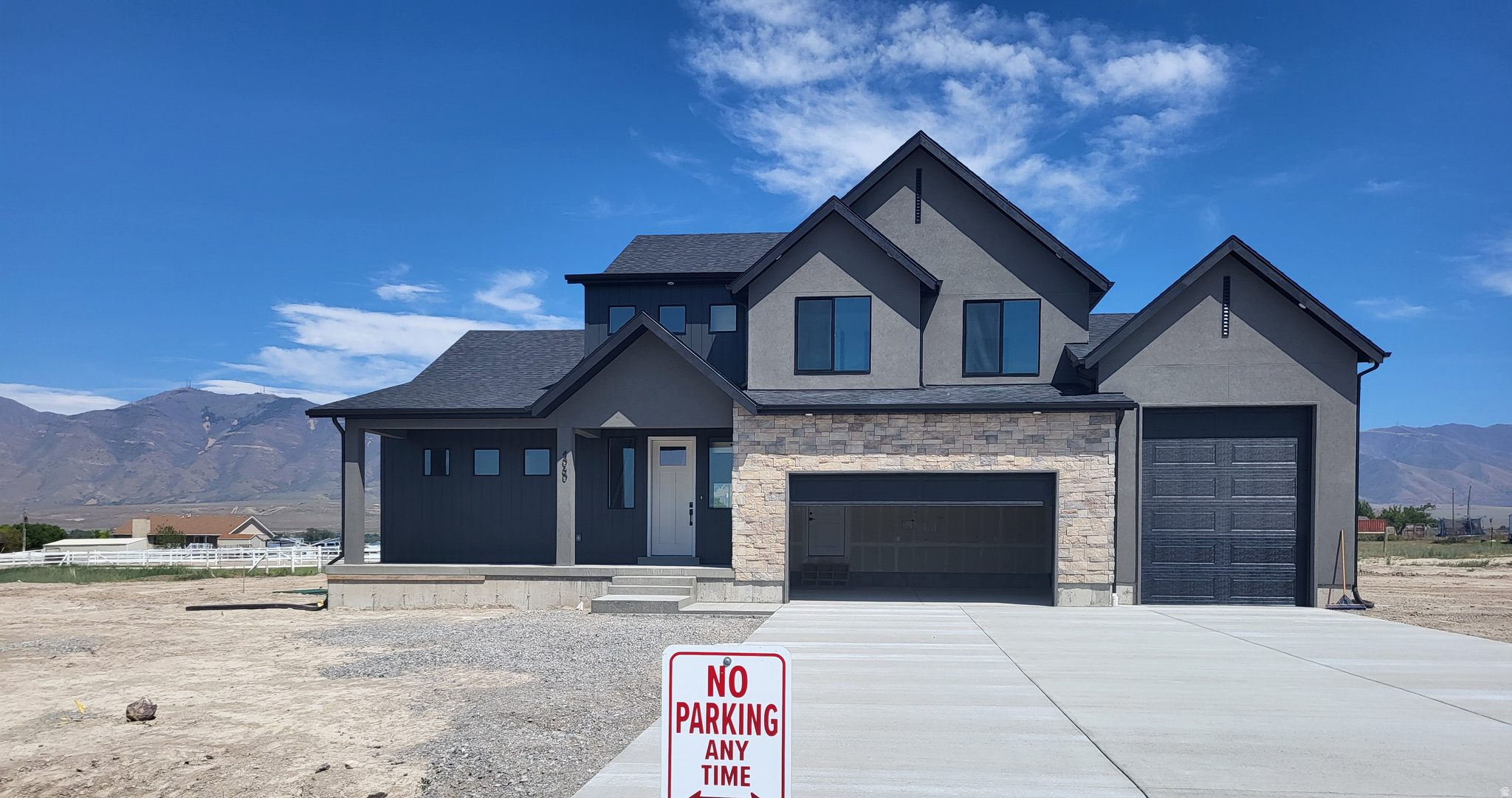 RILEY PARK IN ERDA 1.20 ACRE LOTS.  This home is starting May 1 and will be complete in August!  $9000 towards closing cost with our preferred lender.  This home is under construction with a MAY completion. This amazing PROVIDENCE floorplan sits on 1.20 acre in Erda Utah. The main floor owner's suite has it all: tray ceiling, large walk-in closet with stackable laundry connection, double undercounter sinks, soaker tub and oversized shower. Get cozy in the large family room around the fireplace. The open concept kitchen includes a large island for food prep/counter seating, a large walk-in pantry, kitchen with gas cooktop, 42" upper cabinets w/ crown molding, 30" Single sink, upgraded cabinet with dovetail, soft-close features. Laminate floor throughout the kitchen, dining, & family room. Quartz countertop in kitchen and bathrooms, Powder room located next to the garage entry and mud room bench. Stair railing with newel posts. Upstairs has a loft, 3 large bedrooms, full bathroom, and full laundry room. Home includes unfinished basement with 9' foundation walls, room for a large family room, 2 additional bedrooms, a bathroom, and under porch storage. 2 95% efficient furnaces, 50-gallon water heater, & plumbed for a soft-water system. 3-car RV garage with 12' x 10' door and extra space on the side of the garage to add an RV pad. Sitting on a .50-acre, lot overlooking the valley, this home has it all!  Ask me about our generous home warranties, active radon Mitigation System, and Smart Home Package, which is included in this home. The actual home may differ in color, material, and/or options. Pictures are of a finished home of the same floorplan, and the available home may contain different options, upgrades, and exterior color and/or elevation style. Square footage figures are provided as a courtesy estimate only and were obtained from building plans. No representation or warranties are made regarding school districts and assignments; please conduct your own investigation regarding current/future school boundaries.