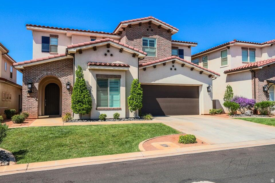 ONE OF THE FEW STAND ALONE UNITS IN COMMUNITY! Luxury Resort Living in Southern Utah! This stunning 5-bed, 5-bath former model home offers a turnkey investment and an incredible vacation retreat. Accommodating up to 24 guests, it features an open great room, a spacious rec room, and designer furnishings throughout. Enjoy two private patios and a hot tub for ultimate relaxation. Let the resort handle rentals when you're away and take advantage of top-tier amenities--clubhouse with games, fitness center, two-tier pool, water slide, lazy river, and pickleball courts. Plus, you're minutes from Tuacahn Center for the Arts, Snow Canyon State Park, and endless hiking/biking trails. Own a piece of paradise.