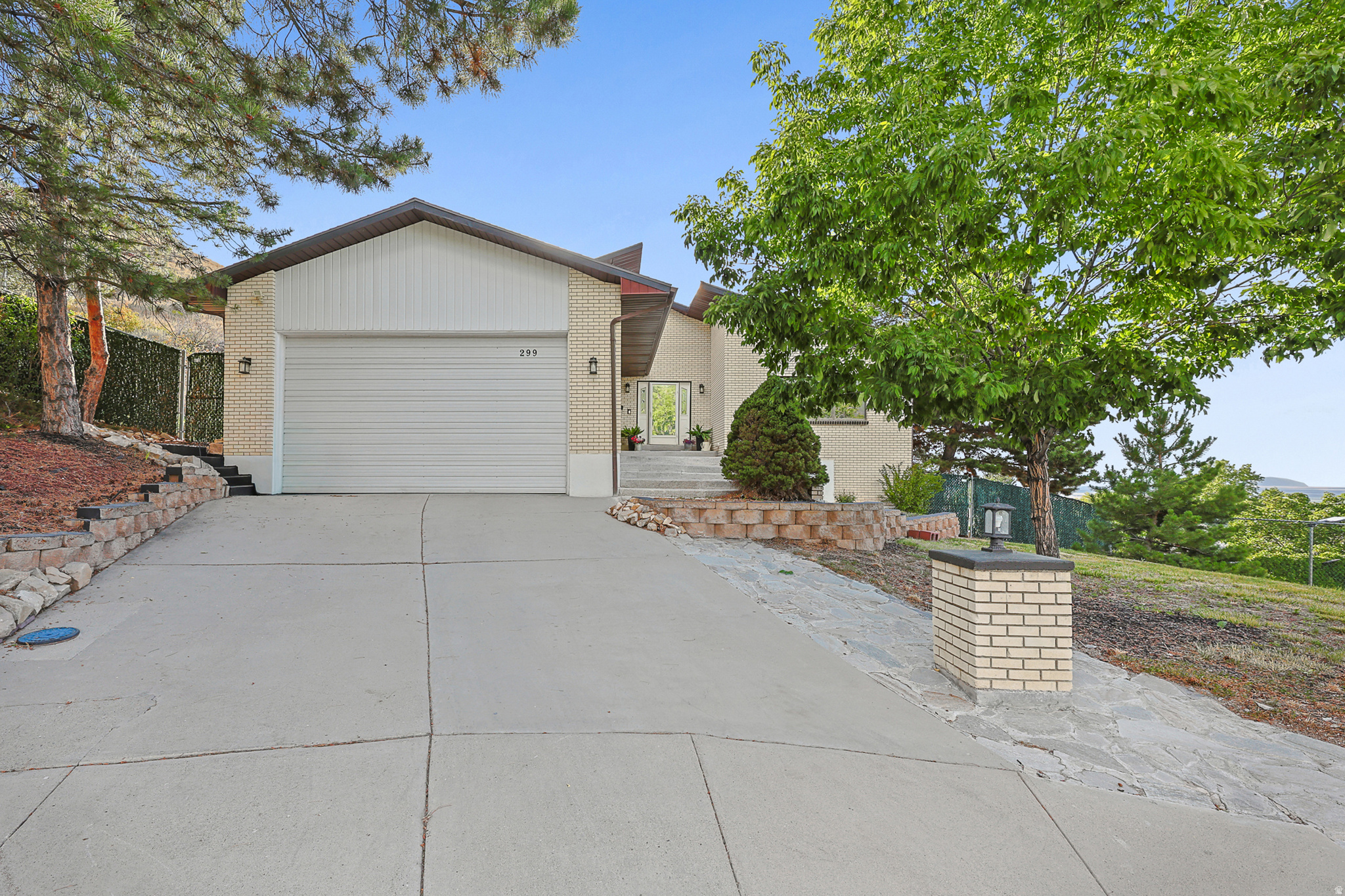 Nestled in the beautiful foothills of Tooele, this exceptional custom home offers breathtaking views. Situated on two parcels included in the purchase price this property provides extra space and possibilities. You will enjoy your own private sport court. Designed with quality, comfort and efficiency in mind, this exceptionally well maintained home has been upgraded wtih 5 new mini splits to give you heat and cooling zone control. New boiler and copper piping with 120 gallon water storage.  (2023) Radon mitigation system installed. New roof, 2021. Master bed has private balcony. Need garage space? owner says it will fit 5 cars, has a wonderful workshop with sink and 220.  The walk out basement includes an internal ADU with its own private entrance, offering exceptional flexibility for multi-generational living, extended guests, a private home office or the opportunity to generate rental income.  A rare opportunity to own this home at such an incredible value. Schedule a private showing today!
