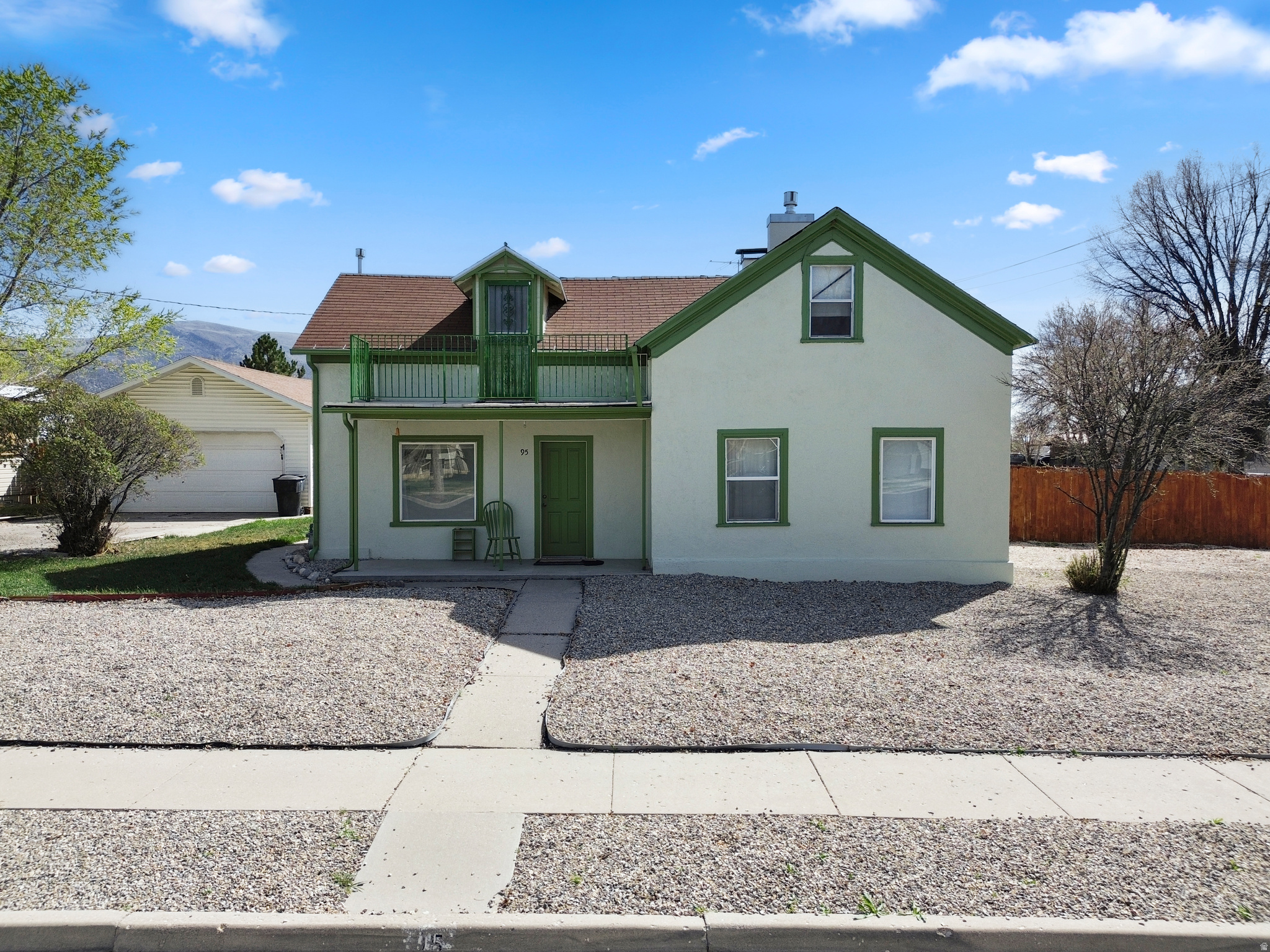 Unique opportunity on a corner lot in Ephraim with flexible living options and income potential. This R2-zoned property is currently set up as a duplex, offering great versatility for an investor or a buyer looking to offset their monthly payment. The upper level features 2 bedrooms, 1 bathroom, a full kitchen, its own laundry room, and a separate entrance, creating a private and functional living space. The lower level offers a similar layout with 2 bedrooms, 1 bathroom, a kitchen, and its own dedicated laundry area, making it ideal for dual occupancy or extended living arrangements. Situated on a spacious 0.33-acre lot, the property provides plenty of room to spread out. The front yard is designed with low-maintenance gravel landscaping, while the fully fenced yard adds privacy and usability. A detached 2-car garage offers additional storage and parking, with a greenhouse located just behind it for those interested in gardening or year-round growing. With its current duplex setup, R2 zoning, and generous lot size, this property presents multiple possibilities whether you're looking to generate rental income, live in one unit and rent the other, or simply enjoy it as a single living space!  Square footage figures are provided as a courtesy estimate only and were obtained from county records.  Buyer is advised to obtain an independent measurement.