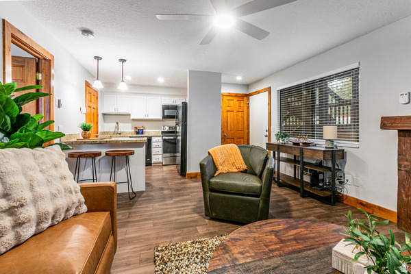Renovated in January 2026, the condo features fresh, modern finishes and can be sold fully furnished, making it a turnkey opportunity for personal use or investment. The ground-floor location opens to a private patio surrounded by mature pine trees, creating a peaceful alpine setting and seamless indoor-outdoor living.  Ideally located at the base of Canyons Village, this beautifully updated Red Pine condo offers the perfect blend of mountain convenience and year-round enjoyment. Amenities include: pool, sauna, hot tub, pickle ball and tennis court, volleyball, bbq/picnic areas. Just a short walk to the Cabriolet lift and steps from the free bus system, you'll enjoy effortless access to world-class skiing, dining, shopping, and apres-ski.  Whether you're looking for a mountain retreat, rental property, or full-time residence, this condo delivers exceptional location, comfort, and charm in one of Park City's most sought-after communities.  Give us a call, don't miss out!