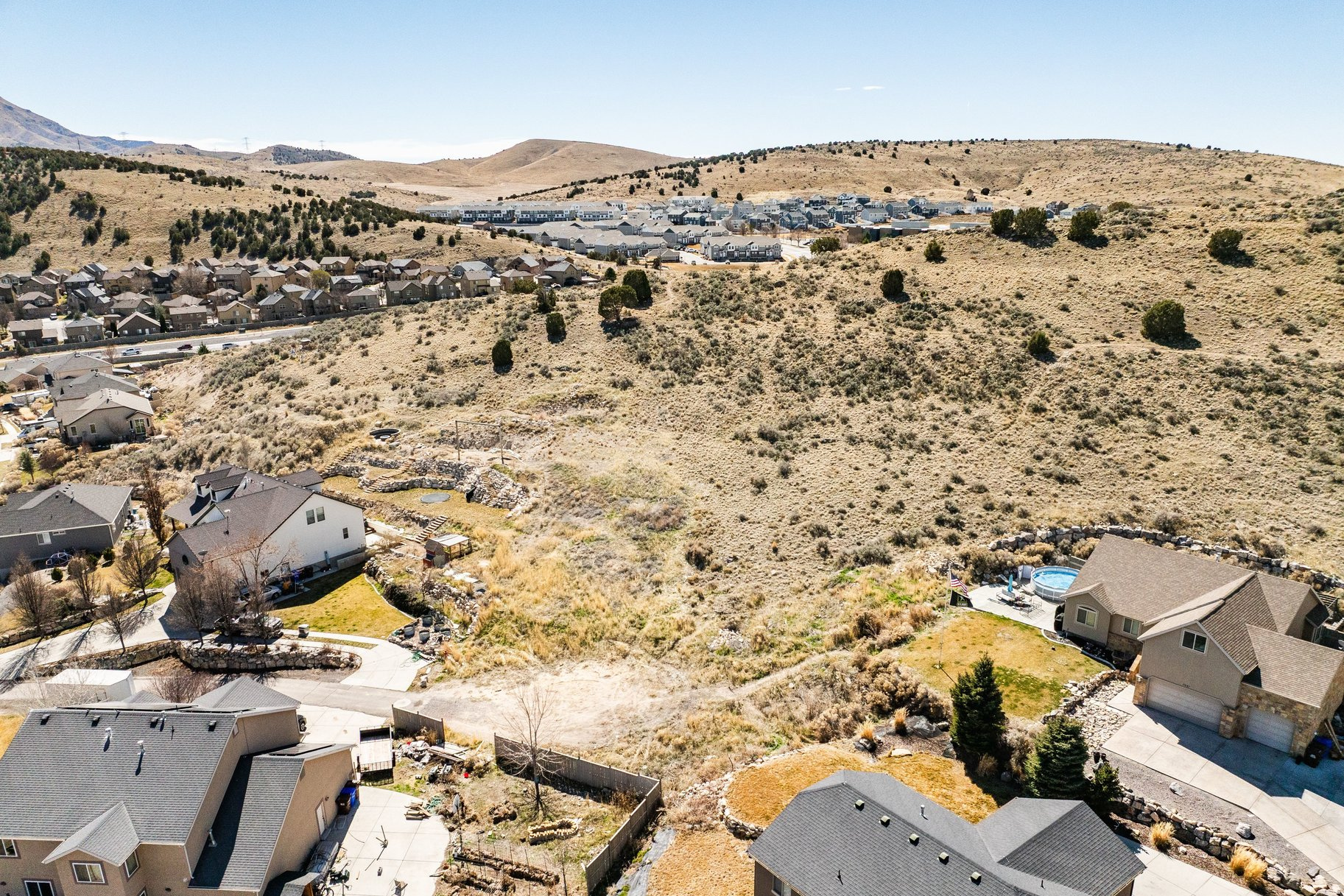 Discover the perfect setting for your future home on this .63-acre lot in beautiful Eagle Mountain. Situated at the end of a cul-de-sac, this gradual slope lot offers expansive views across the valley and vistas of Mt. Timpanogos. The neighborhood features well-kept homes, spacious parcels, and walking distance to parks and schools. Bring your own builder. Utilities are stubbed at the property line.