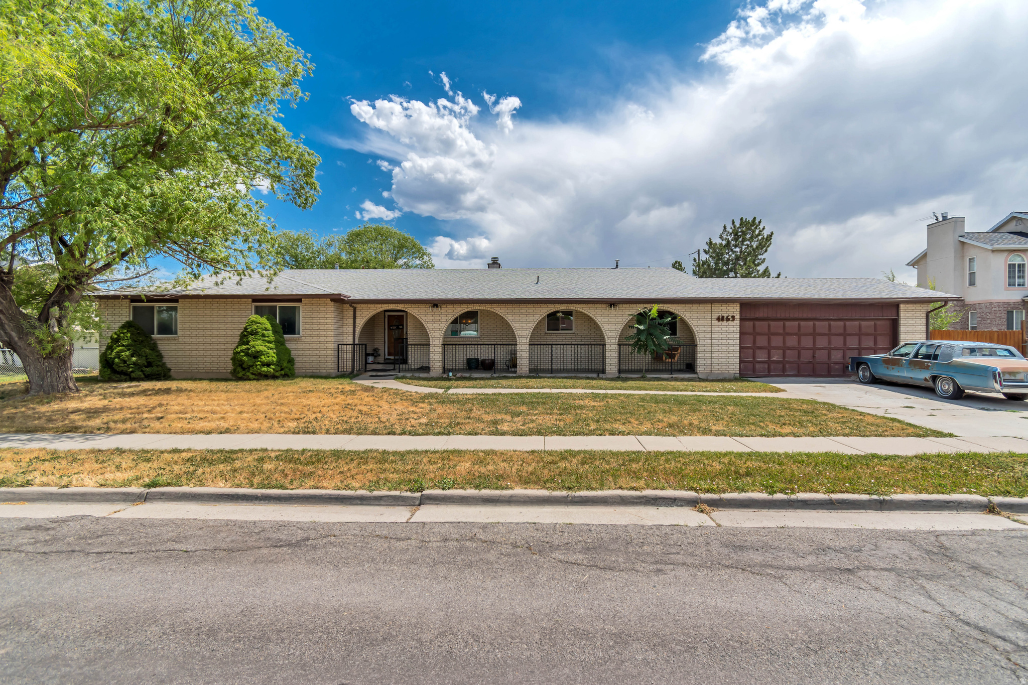 Welcome to this spacious 3,000-square-foot rambler offering the convenience of single-level living, making it an excellent choice for homeowners of all ages. Situated on a generous 0.30-acre lot, this all-brick home features 5 bedrooms and 4 bathrooms, providing plenty of space for family and guests.  The thoughtfully designed floor plan includes a formal dining room, a large kitchen with ample workspace, and a second living room with a cozy fireplace-perfect for relaxing or entertaining. Enjoy outdoor living year-round with covered front and back patios.  Recent updates include a new roof installed approximately 8 years ago and a new HVAC system for added comfort and peace of mind. The property also offers a two-car garage and two storage sheds, providing abundant parking and storage.  Conveniently located near both the elementary school and high school, with a bus stop right in front of the home, this property combines comfort, space, and an ideal location.