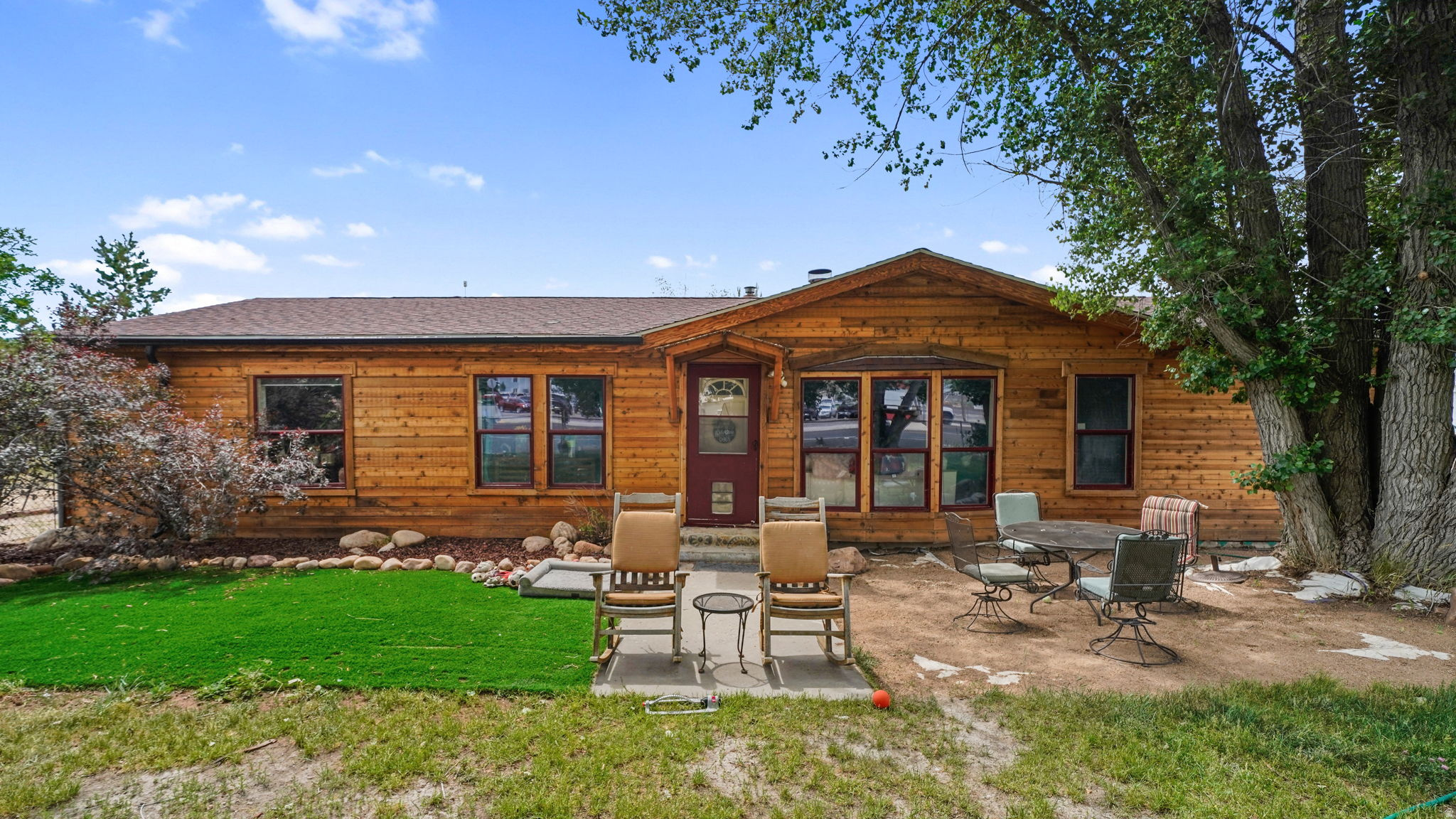 Nestled on nearly an acre of horse property, this beautifully maintained 3-bedroom, 2-bath home offers the perfect blend of comfort, convenience, and outdoor living. Ideally located just minutes from world-class ski resorts, national forest, hiking and biking trails, blue-ribbon fishing, Heber City, and Park City, you'll enjoy year-round recreation while still being within walking distance of local schools, shopping, the rodeo grounds, and a fitness center. The inviting floor plan features a spacious family room that flows seamlessly into the well-appointed kitchen with updated appliances included. The private primary suite offers a walk-in closet and an ensuite bath with dual vanities, a soaking tub, and a separate shower. Two additional bedrooms and a full bath are thoughtfully situated on the opposite side of the home, providing privacy for family or guests. A spacious 3-car garage offers abundant room for vehicles, toys, and storage. Equestrians, hobby farmers, and outdoor enthusiasts will appreciate the impressive 24' x 36' steel barn complete with power and water, making it ideal for horses, livestock, equipment, or workshop space. Enjoy breathtaking mountain views, spectacular sunrises and sunsets, and endless possibilities to create your dream outdoor retreat. Conveniently located just 50 minutes from Salt Lake City International Airport, this exceptional property offers the best of peaceful country living with easy access to everyday amenities and world-class recreation.