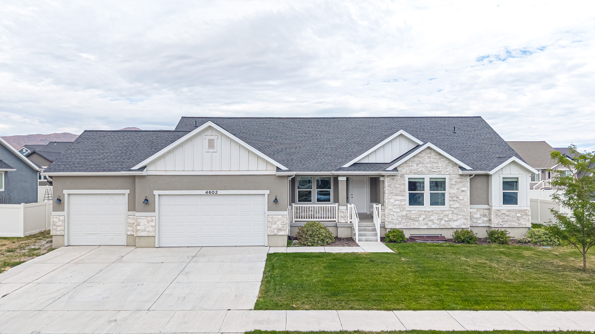 Be sure to check out the 3D tour by clicking on the tour button. Beautifully finished Eagle Mountain home featuring an attached ADU with a private basement entrance - perfect for multi-generational living or rental income! The main home offers 3 bedrooms and 2.5 bathrooms with an open-concept layout, vaulted ceilings, painted cabinetry, quartz countertops, a large center island, gas range, and durable LVP flooring. The spacious primary suite features a Euro glass shower, oversized walk-in closet with built-in organizers, and double vanity sinks. Enjoy a fenced backyard with room for RV parking on the side of the home, making this home truly move-in ready. The backyard is also plumbed for a natural gas BBQ. The attached ADU offers a private entrance and is ideal for extended family, guests, or rental income. Enjoy nearby community amenities including pickleball courts, a playground/park, and soccer fields. This property combines modern finishes, functional design, and exceptional versatility in one of Eagle Mountain's growing communities.