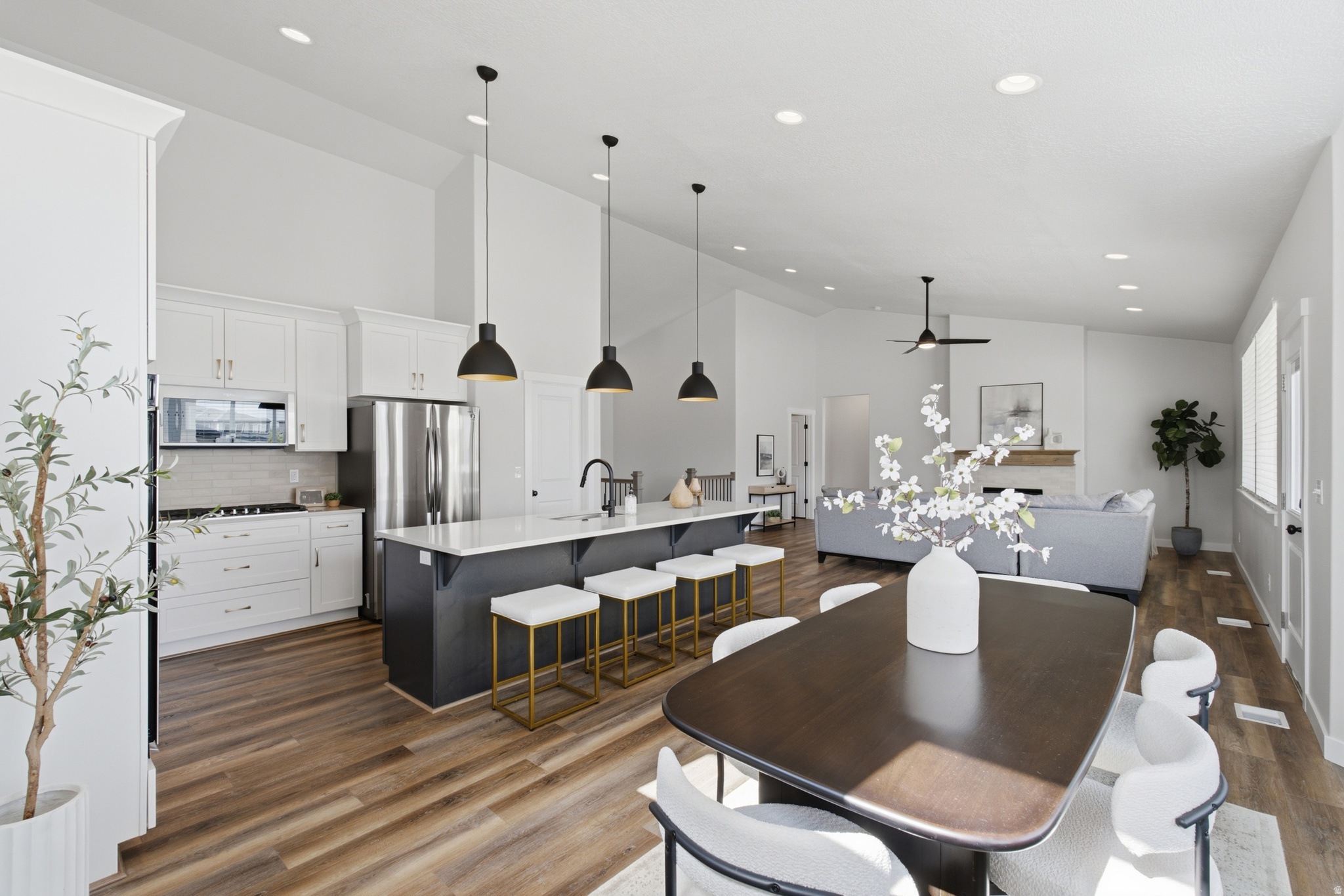 Nestled in one of South Jordan's most sought-after neighborhoods with no HOA, just minutes from the freeway and surrounded by luxury custom homes -- in fact there are 3 homes within walking distance in this year's 2026 Salt Lake Parade of Homes -- feels-like-a-brand-new rambler, with elevated finishes, offers the perfect blend of elegance, functionality, and convenience. The home features a dedicated office off the main entry, a spacious vaulted great room, an oversized quartz island, five generously sized bedrooms, a 2nd kitchen in the fully finished basement with an extra large family room. There is space to add a separate basement entrance, ideal for multi-generational living, extended guests, or future income opportunities. Step outside to enjoy the covered patio and an fully fenced and finished backyard.  Additional highlights include an extra-height, extra-long 3-car garage with ample space for vehicles, toys, and storage. Located just steps from the Jordan River Trail, you'll enjoy miles of scenic walking and biking paths right outside your door, while shopping, dining, and everyday conveniences remain just minutes away.
