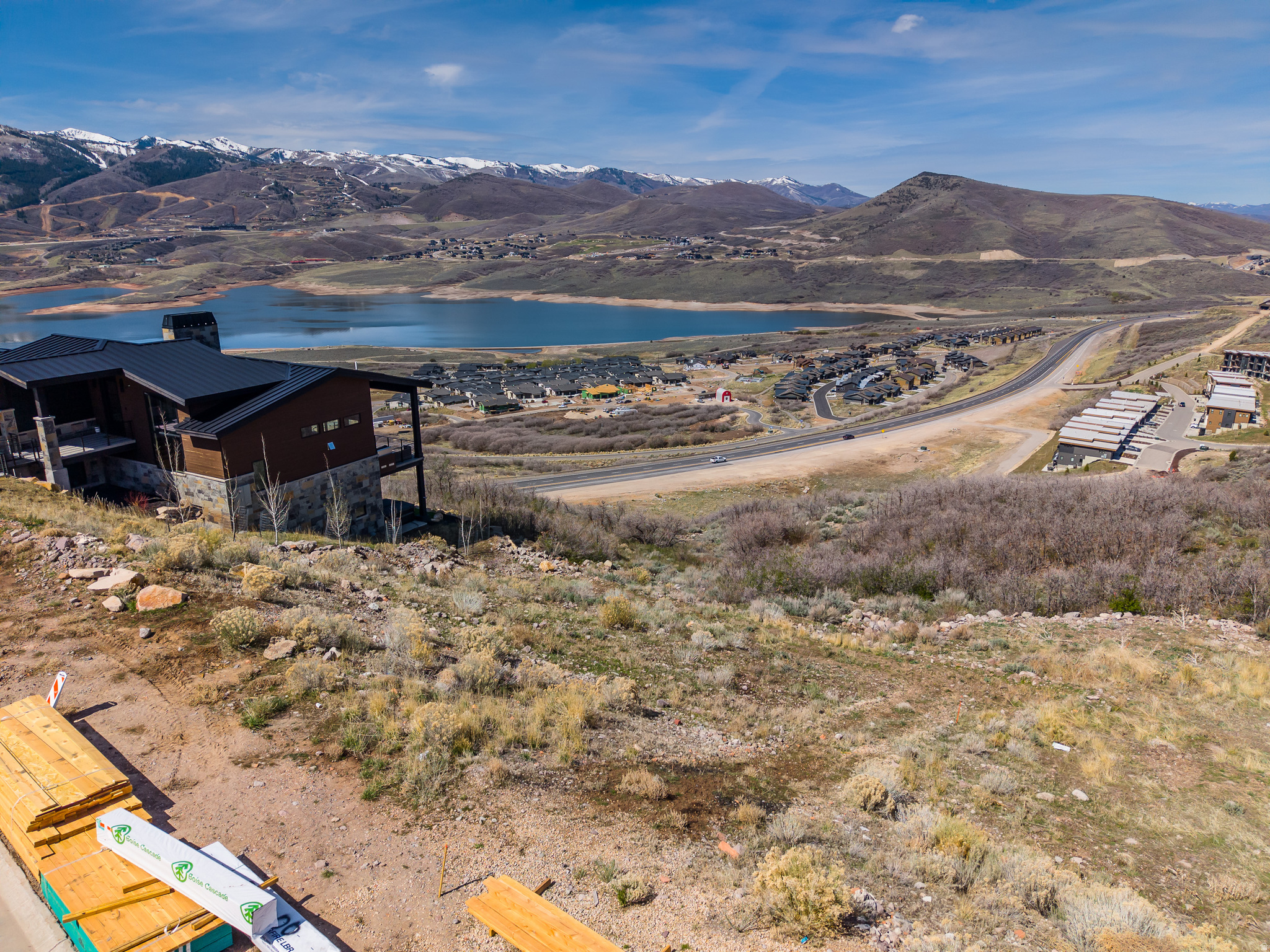 Prime Downhill Homesite in Soaring Hawk Hideout Utah.  This 0.27-acre luxury homesite is situated in the prestigious Soaring Hawk community of Hideout, Utah, representing a premier opportunity for a custom mountain residence. The lot is specifically oriented for a downhill build, which provides the ideal topography for a multi-level home featuring a walk-out lower level and a seamless indoor-outdoor floor plan. As a fully improved and construction-ready parcel, all essential utilities-including water, public sewer, natural gas, and high-speed fiber optics-are already available at the property line. By utilizing the natural slope to maximize vertical square footage, this lot is a top-tier choice for those looking to build a mountain modern masterpiece with efficient development timelines.