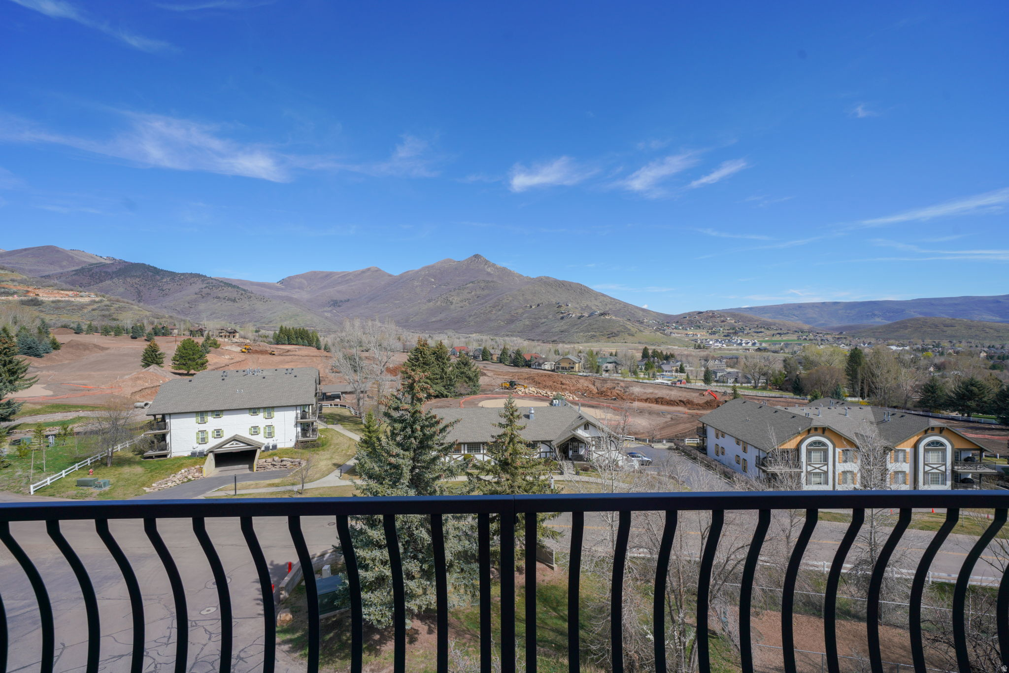 Nestled within the prestigious Swiss Oaks enclave, this meticulously maintained residence offers a rare combination of main-level living and expansive, panoramic views that define the Midway lifestyle. Positioned to capture the dramatic silhouette of the Wasatch Mountains and the manicured fairways of the adjacent Homestead Golf Club, the home serves as a private sanctuary where indoor comfort meets the rugged beauty of the surrounding peaks. The 2,210-square-foot interior transitions effortlessly from an open-concept living space with vaulted ceilings featuring amazing skylights and a cozy fireplace to a fully finished basement. Expansive windows and two private decks offer the ultimate vantage point for enjoying the crisp mountain air and unobstructed vistas. The beautiful natural grounds are adorned with mature trees, pines, and scrub oak, enhancing the property's natural charm. Residents enjoy an unparalleled resort-caliber amenity package including a clubhouse, hot tub, dry sauna, gym, and courts for pickleball and tennis. High-speed internet and water costs are paid by the HOA, as well as snow removal.