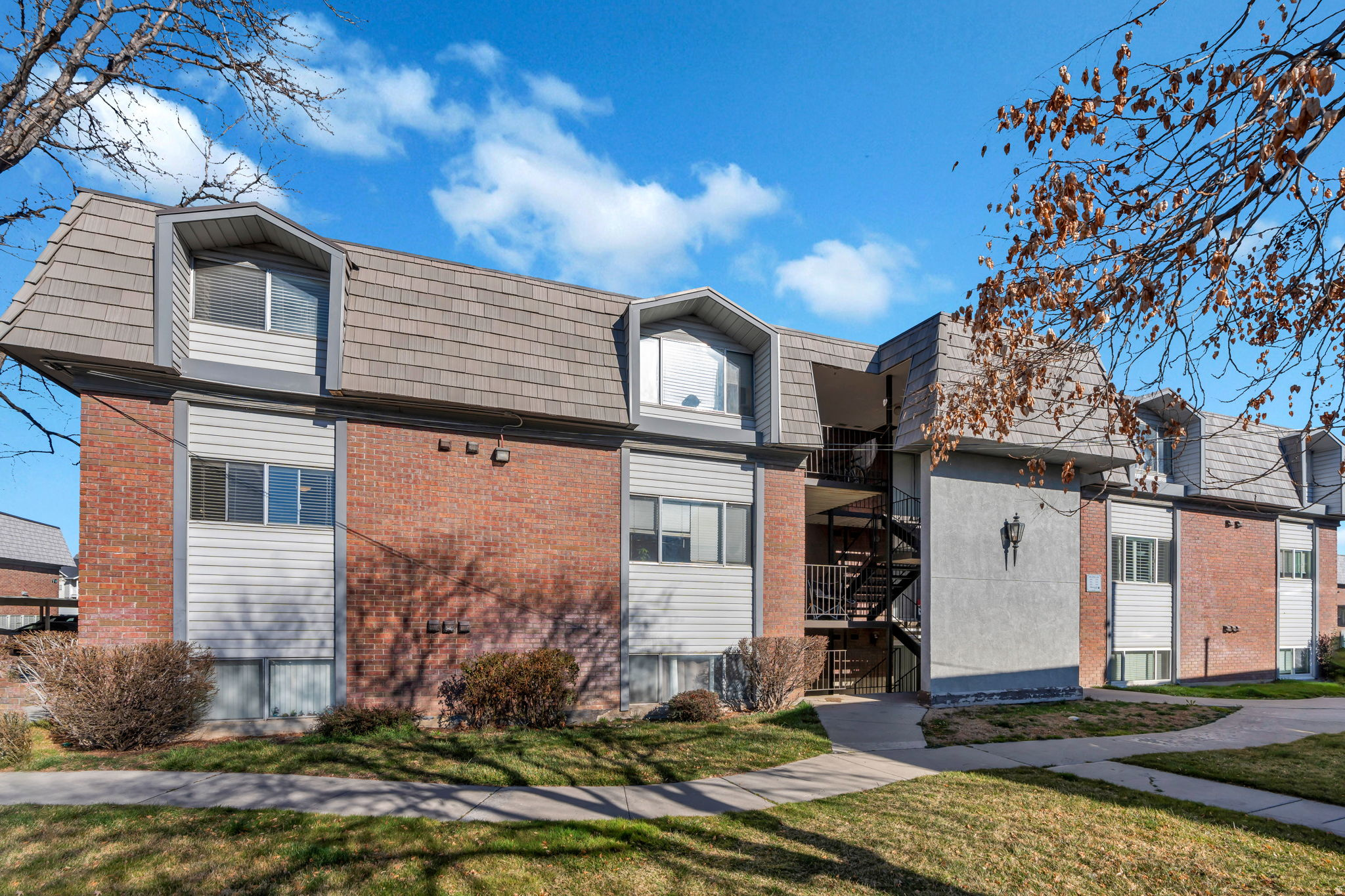 Seller Finance! Contact listing agent for more info! Well-maintained 3-bedroom, 1.5-bath condo in the desirable Willowbrook community of Provo. This centrally located Provo property offers exceptional convenience just off State Street, providing quick access to shopping, dining, parks, and less than a 5-minute drive to Brigham Young University. The kitchen features white cabinetry, a built-in dishwasher, and an island that provides additional seating and prep space. The open-concept layout flows seamlessly into the spacious living area, filled with natural light and highlighted by a cozy fireplace. Willowbrook residents enjoy an impressive list of community amenities including a pool, spa, sauna, fitness center, clubhouse, tennis courts, racquetball courts, playground, barbecue and picnic areas, and beautifully maintained grounds. HOA dues also cover maintenance, sewer, water, trash, and snow removal, helping simplify ownership. The property is currently tenant-occupied with a lease generating $1,800 per month, offering immediate rental income and strong investment potential. Measurements provided as a courtesy only, buyer to verify all info.