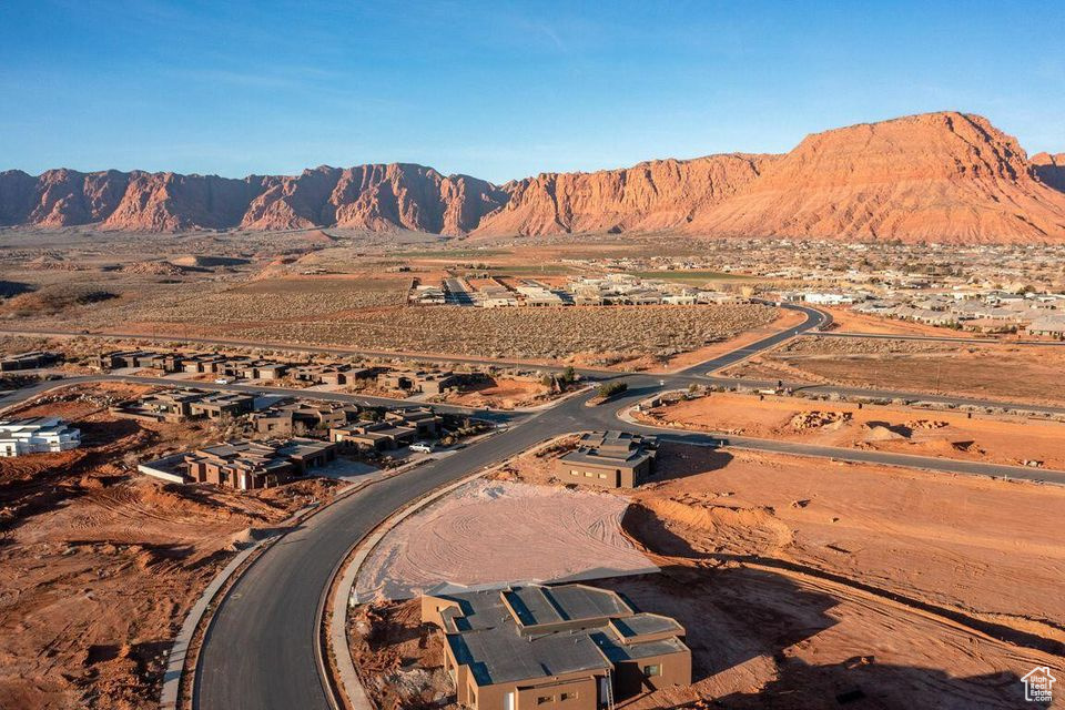 Build your dream home in one of Ivins' most desirable communities. This pad-ready lot in Indigo Trails offers stunning, unobstructed views of Red Mountain, Snow Canyon, and Pine Valley Mountain - the ultimate backdrop for a custom residence designed to reflect your vision and lifestyle.  Enjoy close proximity to the Kayenta Art Village, Snow Canyon State Park, Anasazi Ridge Petroglyphs, Fire Lake Park, and the Tuacahn Amphitheatre. World-class wellness resorts like Movara and Red Mountain are just minutes away, blending luxury, adventure, and restoration into daily life.  With an Indigo Trails Approved Builder in place, your path to building is streamlined and secure. Start planning your dream home today - this lot is ready when you are.  Schedule a site visit to experience these views in person. Opportunities like this don't last - inquire now before it's gone. Lot and Construction financing options available!  Contact agent for details!