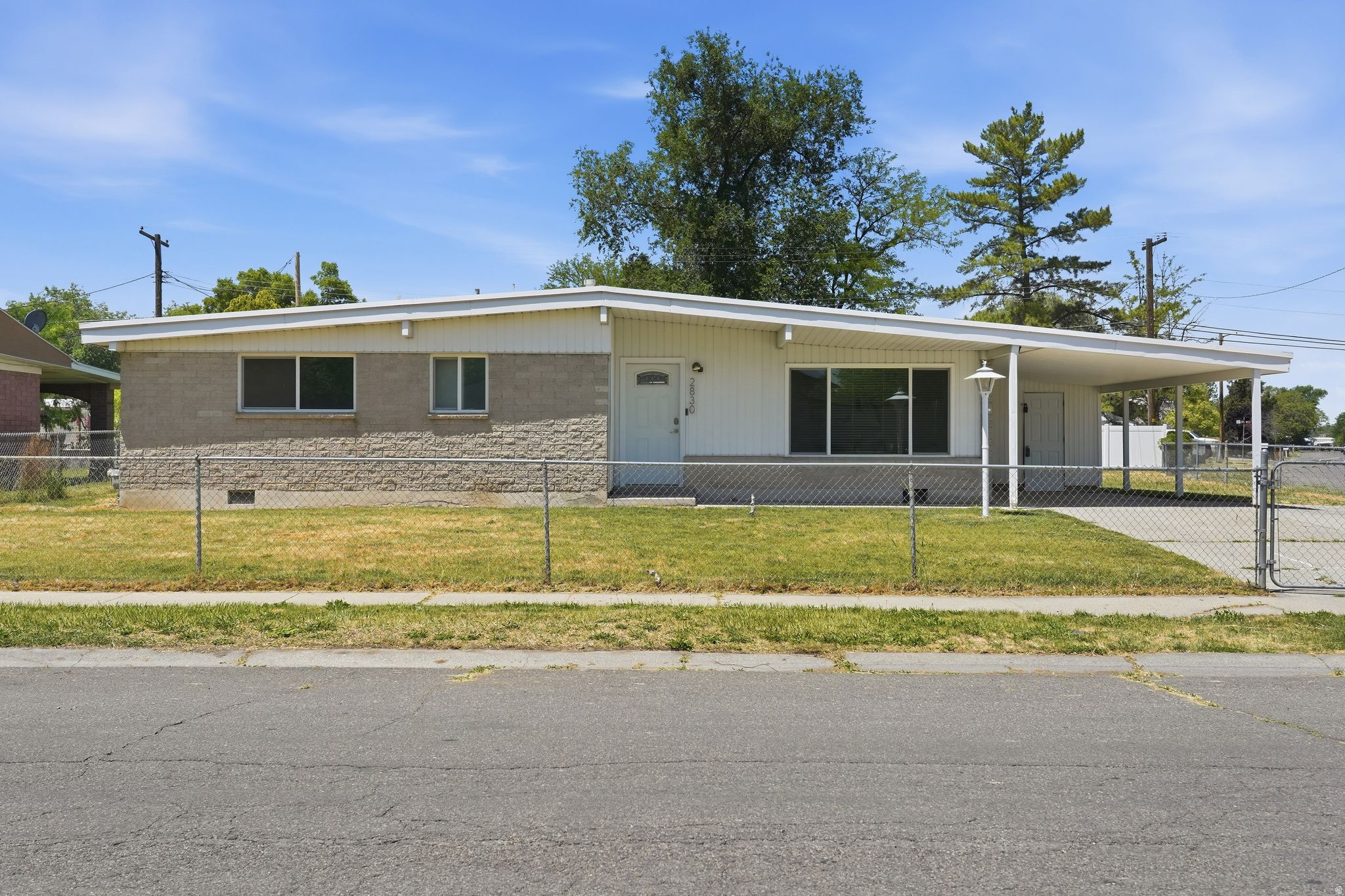 MULTIPLE OFFERS RECEIVED. HIGHEST AND BEST DUE MONDAY JUNE 8th by 6PM. Perfect starter home! This corner lot cutie on almost a quarter acre and under $400K! Plenty of room to grow, expand, and park your RV. Updated bathrooms, a large master suite where morning sunlight pours through the windows, and polished floors that are truly move-in ready for its next owner. Updated sewer and plumbing (a nearly $25K investment), energy-efficient windows, fresh paint, and a furnace & A/C that the seller has thoughtfully serviced every single year. Fully fenced with updated vinyl fencing, this home is flooded with natural light inside and out. Walking distance to Stansbury Elementary, minutes to I-215, parks, restaurants, and everything Valley Fair Mall has to offer. This home has been loved and now it's ready for you!   Square footage figures are provided as a courtesy estimate only and were obtained from county records.  Buyer is advised to obtain an independent measurement.