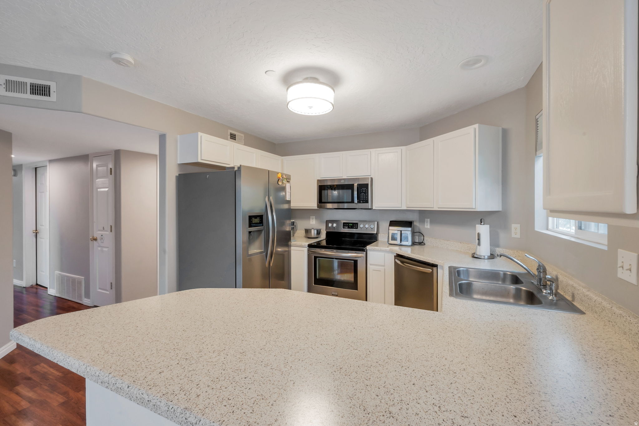 Seller is willing to help contribute to an interest rate buy down. Come see this charming condo in the heart of Bluffdale-now offered at a new price! Perfectly located with quick and convenient freeway access, this home also offers the rare benefit of being within walking distance to grocery shopping, entertainment, and more. Nestled in a quiet community within one of the area's most exciting and rapidly growing neighborhoods, it provides both comfort and convenience. Offering newly painted cabinets for a fresh new look. The well-designed layout features 3 bedrooms and 2 bathrooms, offering comfortable, functional living with a space that's easy to maintain and enjoy. Don't miss the opportunity to own a beautiful home in a fantastic location with low-maintenance living!