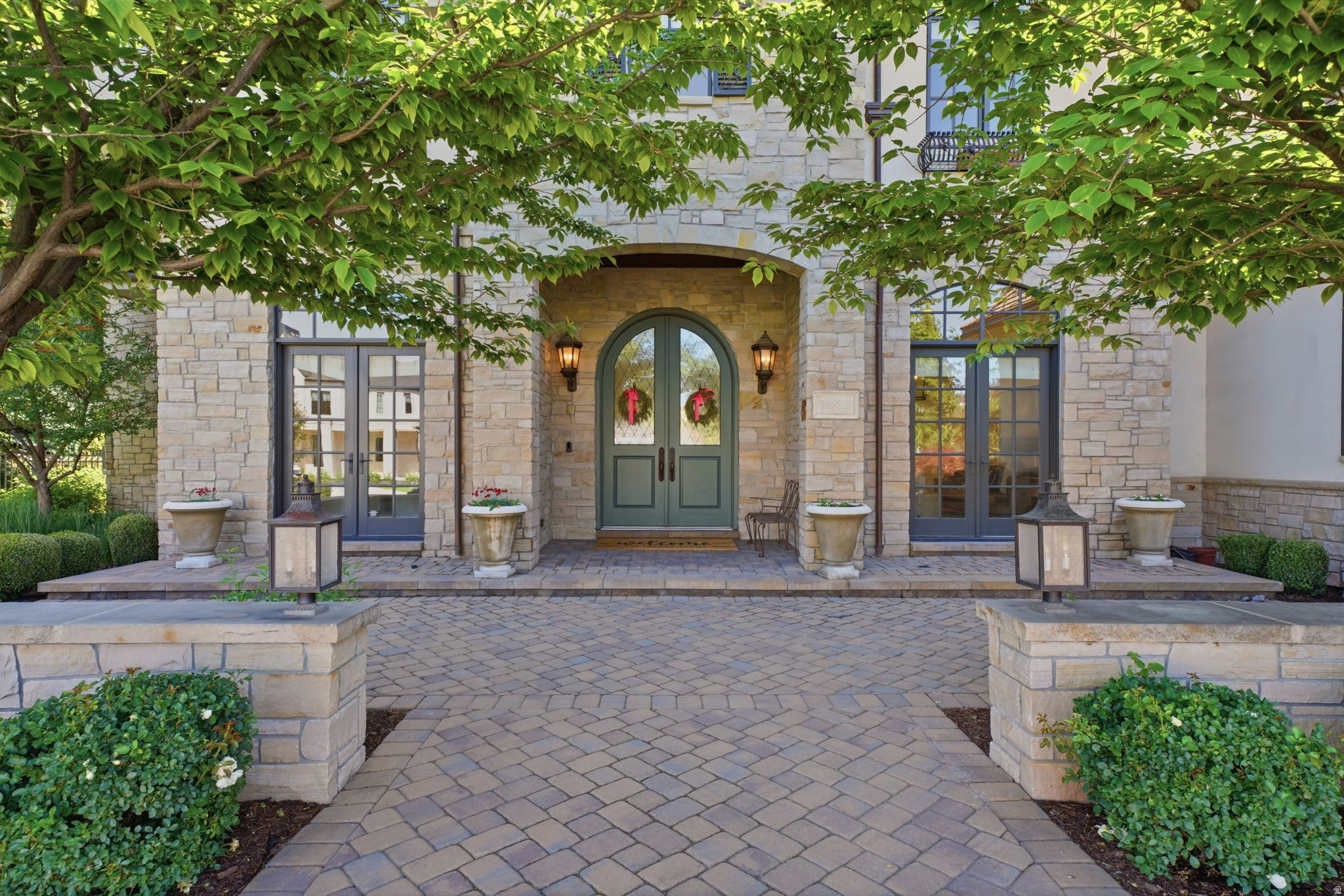 Completely reimagined and move-in ready, this 7,780 sq ft home in Orem's Berkshires neighborhood sits on a private half-acre with mountain views. The heart of the home is an open kitchen, eating area, and beam-ceiling family room that live as one expansive space over new white oak floors. The rebuilt chef's kitchen is built for entertaining, with marble counters, a walnut island, and a full butler's pantry adding extra oven space, a second sink and dishwasher, and an ice machine. A main-level den and a large mudroom with storage round out the main floor.  The main-floor primary suite is a private retreat with a spa bath, soaking tub, and two walk-in closets, one with its own washer and dryer. Upstairs offers a second primary suite, additional bedrooms, a full laundry room, and a massive great room with built-in beds that works as a guest space, kids' retreat, or bonus living area.  Outside is a resort-style backyard with a pool, hot tub, pergola, fire features, a putting green, and a trampoline. Additional highlights include four fully remodeled bathrooms, an oversized 4-car garage with built-in storage, Vantage smart lighting, Sonos audio, new HVAC with whole-home humidity, and a built-in hair salon with its own private entrance.  Square footage is a courtesy estimate from the MLS; buyer to verify.