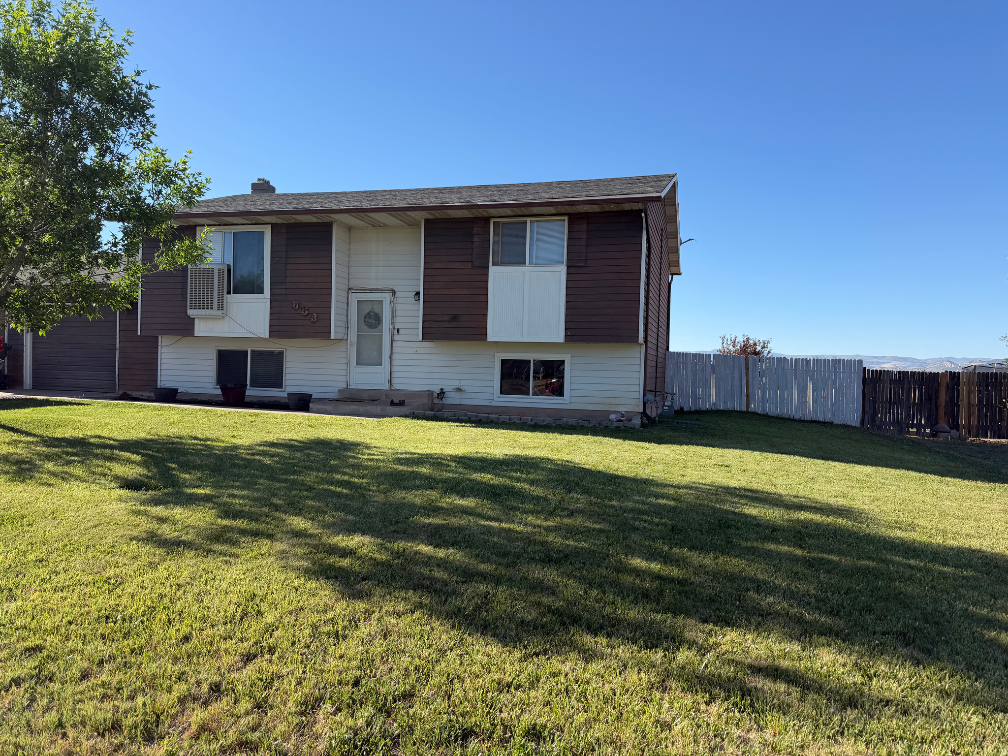 Welcome home to this well-maintained 4-bedroom, 2-bath residence situated on a spacious 1/3-acre lot in a desirable Vernal location. Offering plenty of room both inside and out, this property features a comfortable floor plan designed for everyday living and entertaining. The fully fenced backyard provides privacy and space for children, pets, gardening, or outdoor gatherings. A 2-car attached garage offers convenient parking and additional storage. With ample yard space and endless possibilities, this property is ready for you to make it your own. Don't miss the opportunity to enjoy the benefits of a larger lot while still being close to schools, shopping, and local amenities. Schedule your private showing today!