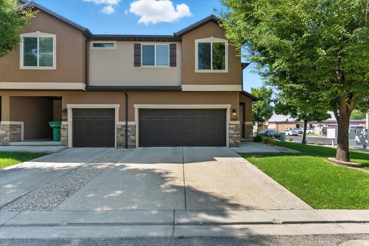 Here is an incredible row-end townhome in the heart of Layton! Featuring a large two-car garage, plenty of storage space, and a fully fenced private backyard with low maintenance lawn. Once inside, you are drawn to the amazing kitchen with dark mahogany cabinets and all new stainless steel appliances. The main floor also includes a large living room, breakfast bar, and dining area with sliding glass doors leading out to the private backyard. The upper level features a large primary bedroom with en suite and large walk-in closet. An additional two bedrooms, a full bathroom, a built-in desk and laundry room round out the upper level. The location is unmatched! Just a short walk away from shops, restaurants, and less than 10 minute drive to Hill Air Force Base.