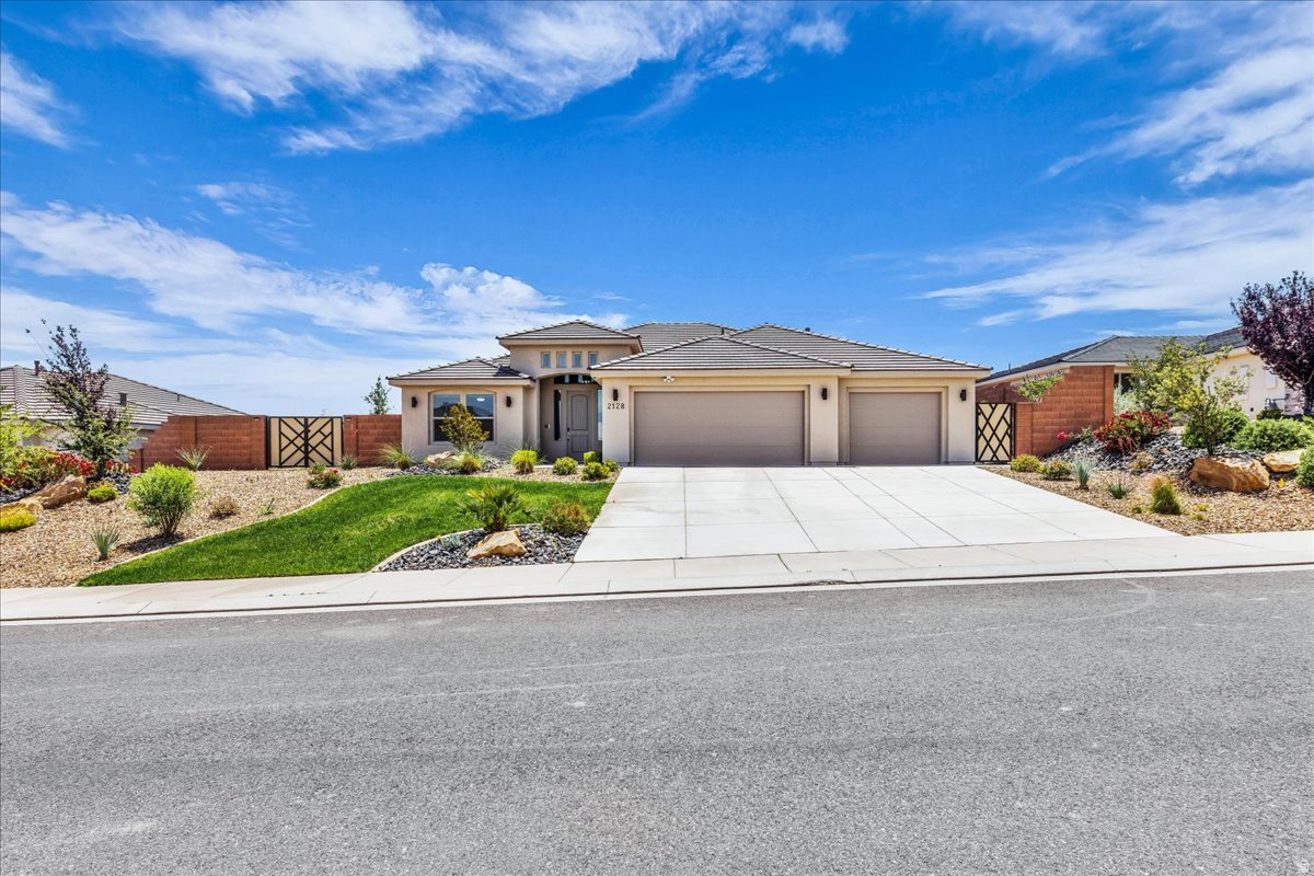 Modern desert living meets comfort and style in this beautifully designed home featuring an open-concept layout, soaring ceilings, and expansive living spaces filled with natural light. The stunning kitchen is the centerpiece of the home with a massive quartz island, sleek dark cabinetry, designer lighting, walk-in pantry, and seamless flow into the spacious great room--perfect for entertaining or everyday living. Additional upgrades include electric blinds in living room and primary bedroom, samsung appliances, upgraded cabinetry throughout, upgraded LVP flooring. Step outside to a large covered patio and fully fenced backyard with plenty of room to create your dream outdoor retreat while enjoying peaceful desert surroundings and mountain views. Complete with a 3-car garage, beautiful curb appeal, and located in a desirable neighborhood, this home combines modern elegance with functional living
