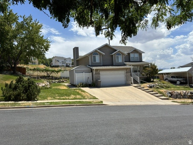 Smart-Design Family Home with Stunning Views. This highly efficient, custom-optimized 3,013 square foot multi-level home features 5 bedrooms, 3 bathrooms, and an extra-wide 3-car parking driveway with a 2-car garage. Situated in a highly desirable, quiet North Salt Lake neighborhood, the property sits within easy walking distance to Adelaide and Orchard elementary schools, and just minutes from downtown Salt Lake City and the airport. Enjoy spectacular panoramic views of the Great Salt Lake and Antelope Island directly from the covered, spacious front porch. The engineered layout is optimized for incredibly low-overhead living, with gas and electric utility bills each typically under $80 per month. High-efficiency features include a natural-gas furnace, water heater, stove, and laundry dryer, alongside a heavy-duty automatic backup generator hooked directly to natural gas. The property includes hard-wired neighborhood fiber-optic internet and a commercial-grade video surveillance network featuring 5 outdoor cameras, 1 garage camera, and 1 indoor camera. An upstairs office/bedroom functions as a year-round workspace or cooling oasis, equipped with an independent split-unit AC for targeted, energy-efficient climate control. The floor plan delivers massive storage capacity designed for ultimate organization. The basement features 100% finished living spaces plus two distinct high-utility storage areas equipped with heavy-duty, commercial grocery-warehouse steel shelving. Storage Room 1 functions as a naturally cool, concrete-wall vault optimized for long-term food preservation. Storage Room 2 serves as an optional, pre-engineered roughed-in 1/2 bathroom ready for custom finishing. Additional highlights include a convenient huge kitchen pantry, conversation counter bar, second-level laundry room, built-in window bench boxes in three upstairs bedrooms, and easy-clean flooring in all high-traffic corridors. The rear of the garage houses a fully operational one-operator beauty salon, easily convertible back to a traditional workshop or standard garage space. A tall 10x12 storage shed rests on a solid concrete pad adjacent to the garage. Shown by appointment only to pre-qualified buyers. Buyer to verify all information.