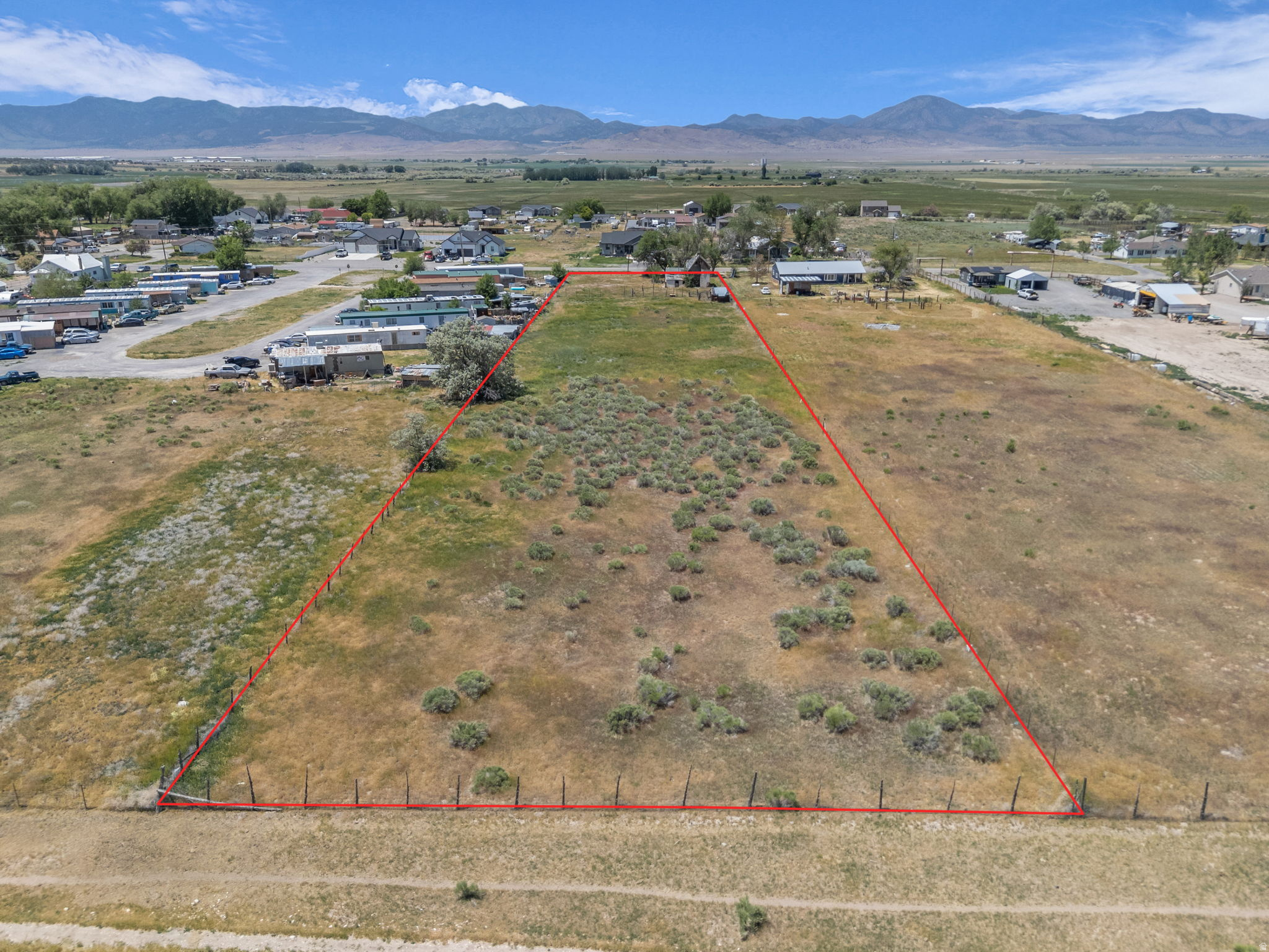 Check out the 3D Land Tour and Video in listing! Discover the perfect balance of tranquility and convenience with this beautiful flat 1.99-acre lot, ideal for your dream homestead. Located less than 15 minutes from the interstate, this spacious property offers the peaceful charm of small-town living while keeping you close to modern amenities. All utilities are at the road.  Per Goshen this can be subdivided but most likely would have to be 2 lots due to the road that would need to be done! That would be part of the buyers due diligence to get exact information from the Goshen Planning committee.
