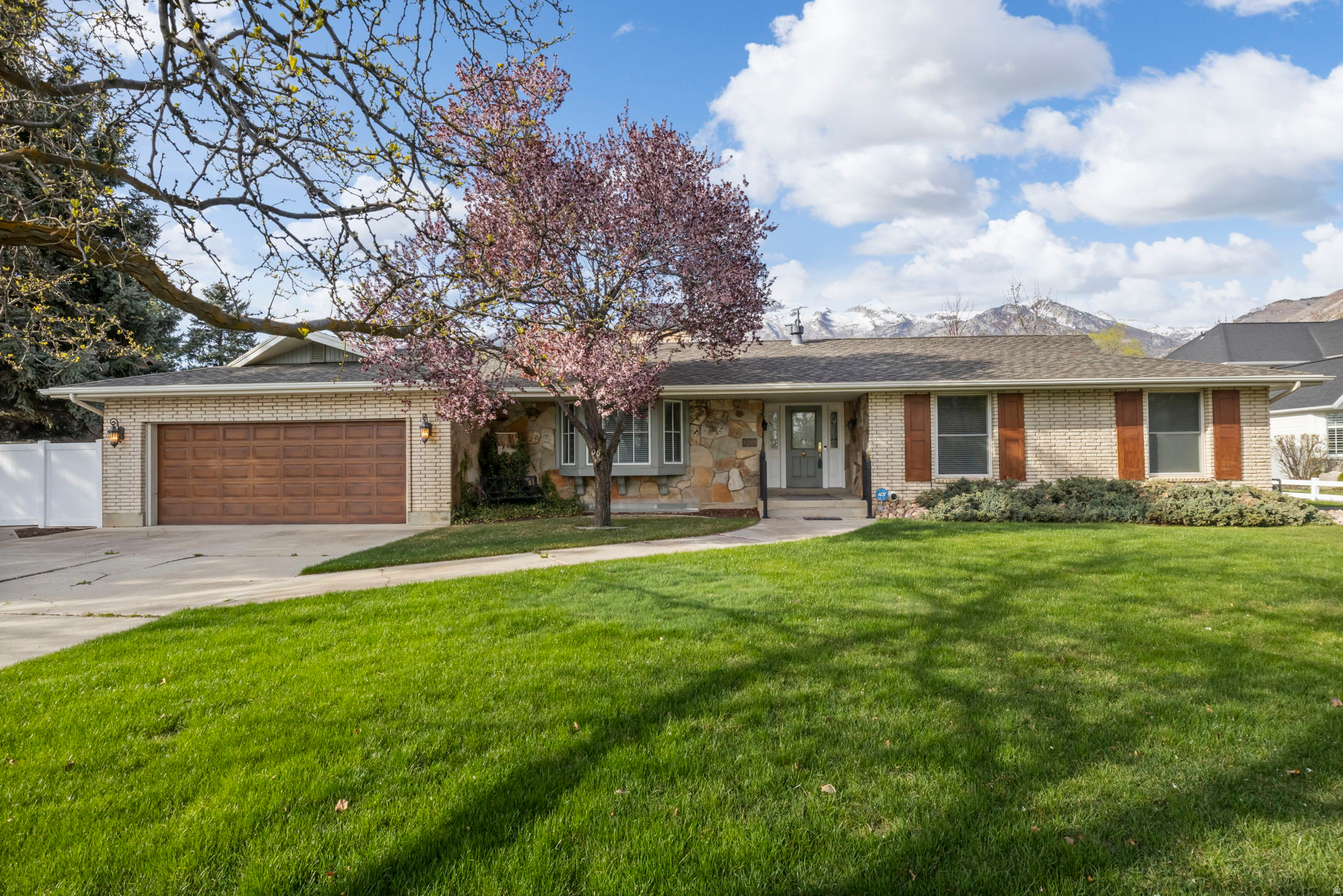 OPEN HOUSE*SATURDAY*JUNE 27*11-2. Updated tile in bathrooms! Turnkey Alpine Horse Property | 7 Bed | 3 Fireplaces | Mountain Views | Basement Apartment. Opportunities like this are rare in Alpine. This exceptional 3,959-square-foot home sits on a beautifully landscaped .89-acre lot with breathtaking mountain views. From the moment you step inside, the quality and care poured into this home are undeniable. The formal living room welcomes you with a classic bay window, a cozy fireplace, and exquisite crown molding that sets an elegant tone throughout. The hallway flows naturally into a warm, inviting kitchen anchored by a second fireplace featuring a one-of-a-kind custom mantle, handcrafted by a Park City artist. A step-down sunroom floods the space with natural light from every angle, the perfect spot to unwind or entertain. The main level is completed by three bedrooms, two bathrooms, and a generous laundry room with extra-large storage. Downstairs, the fully finished basement is a standout feature. With its own private entrance and a full kitchen, it functions beautifully as a mother-in-law suite, guest apartment, or income-producing rental. Four additional bedrooms offer flexibility, including one impressively spacious room currently used as a craft room. Outside, the fully fenced and meticulously landscaped grounds offer mature fruit trees, a charming gazebo, a 30x23 ft detached garage or workshop, and an industrial-grade water filtration system, everything you need for equestrian living or simply enjoying the space in style. This is Alpine living at its finest. Don't miss your chance to own one of the valley's most complete and character-rich properties.