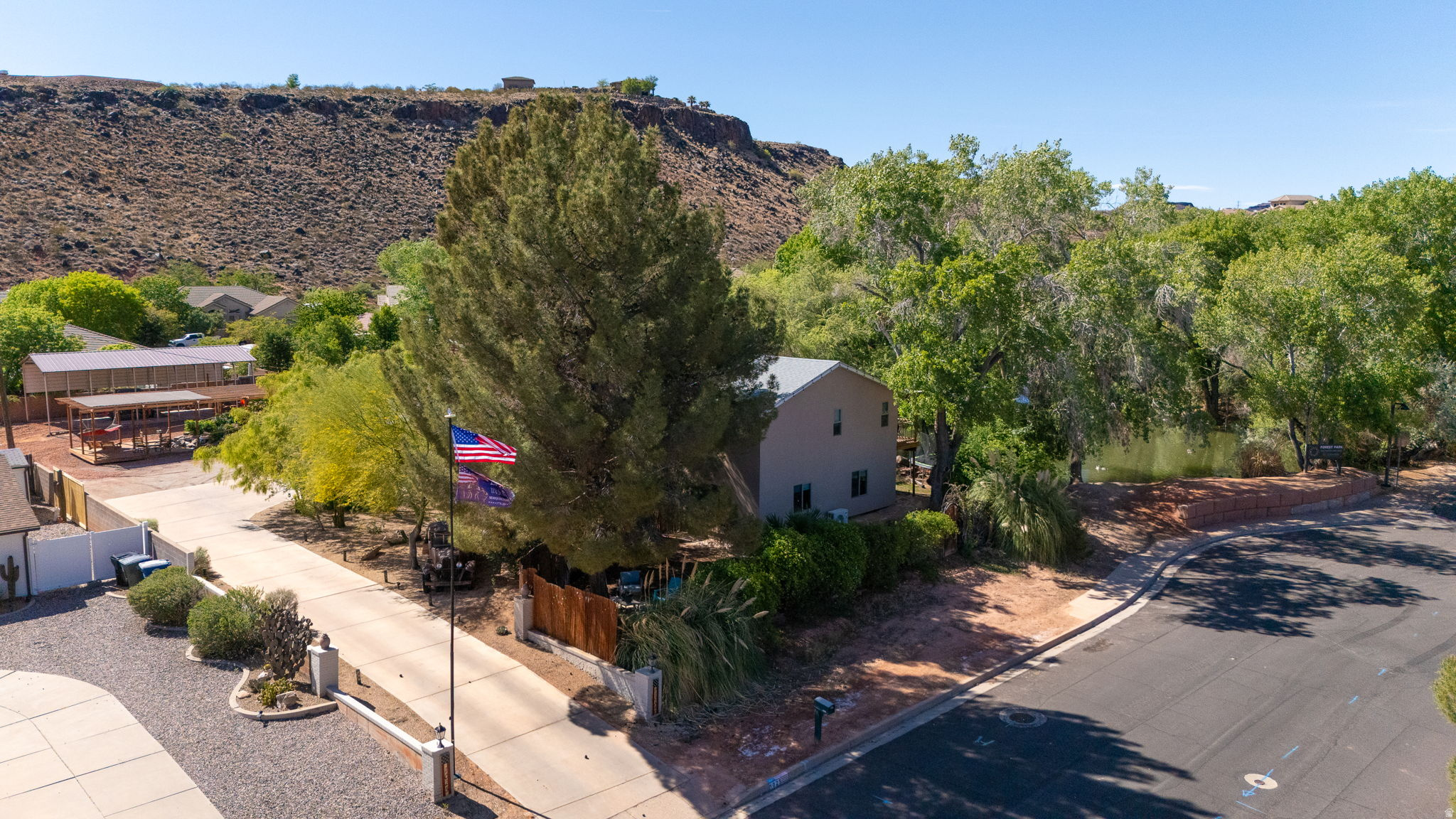 Private Waterfront Homestead Estate on Acreage with Casita and Shop. A rare offering of refined country living in the heart of St. George, this private 1.05-acre estate delivers an exceptional blend of comfort, tranquility, and natural beauty. Centered around a stunning year-round spring-fed pond the setting is both peaceful and picturesque--complete with water views, mature landscape, and abundant wildlife.  The residence features 4 bedrooms and 4 bathrooms, including a newly completed 1100 sq ft addition designed with elevated finishes and functionality. Seamless connection between indoor comfort and outdoor living.  An attached 400 sq ft casita provides ideal flexibility for guests, multigenerational living, or a private office or studio--offering both convenience and privacy within the home's overall design.  Outdoors, the property transforms into a private retreat. Enjoy quiet mornings by the water, and take in the unmatched serenity of this one-of-a-kind setting. With ample space for animals, gardens, or future enhancements, the estate offers both immediate enjoyment and long-term potential.  Ideally located just minutes from premier dining, shopping, medical services, and outdoor recreation near the Red Cliffs Reserve, this property represents a rare opportunity to own a truly distinctive, fun, and comfortable estate in St. George.