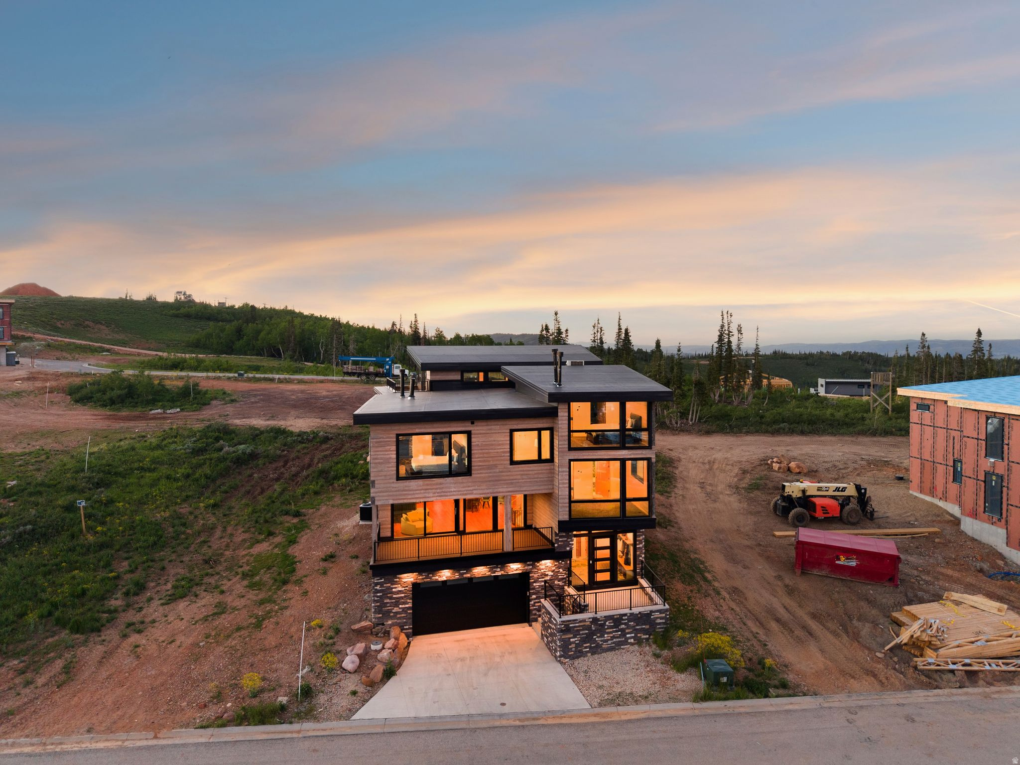 Completed Luxury in Powder Haven at Powder Mountain! Set high above the valley in Powder Haven, this newly built mountain residence is a statement of modern craft and alpine privilege. Natural materials, dramatic stone, and walls of view glass create an atmosphere that feels curated, calm, and undeniably elevated. The arrival experience is intentional, from a stone-floored entry to a light-filled great room that invites long dinners, late fires, and effortless entertaining. The kitchen is sleek and functional, anchored by an expansive island and premium appliance suite, while each bedroom suite offers the privacy and comfort of a boutique retreat. Spa-inspired baths showcase striking tile and stone, double vanities, and a soaking tub designed for slow mornings. A dedicated office adds everyday practicality without compromising the aesthetic. After skiing, hiking, or lake days, the home turns into a private wellness escape with a sauna and a covered terrace with hot tub for a restorative finish. In a community where completed homes rarely come available, this is a scarce opportunity to own now, not later. Powder Haven private ski club membership available for purchase separately and is not included with the home.  Subject to availability, approval, fees, and club terms.