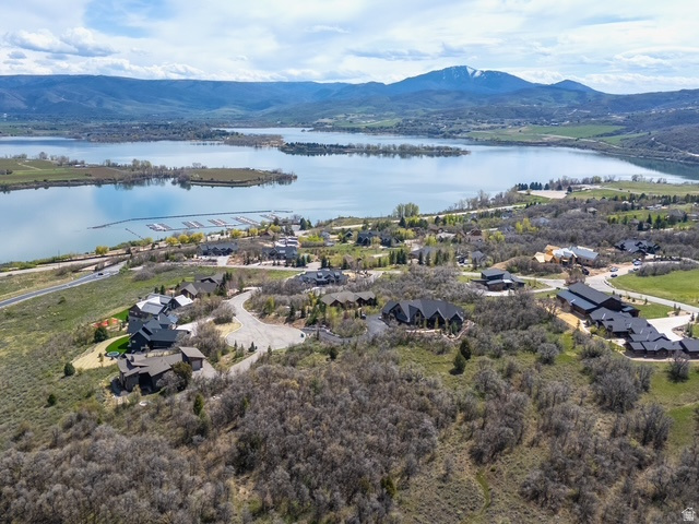 Amazing piece of land to build your dream home on with a beautiful view of Pineview Reservoir right out your front door, close by Nordic Valley , Powder Mountain, and Snow Basin ski resort, in the summer time you have access to all the Amazing hiking and biking trails, this lot is tucked backed in with the most privacy and the best mountain views from all around, you also have the Luxury of the gated community and all the perks with a private clubhouse for residents.