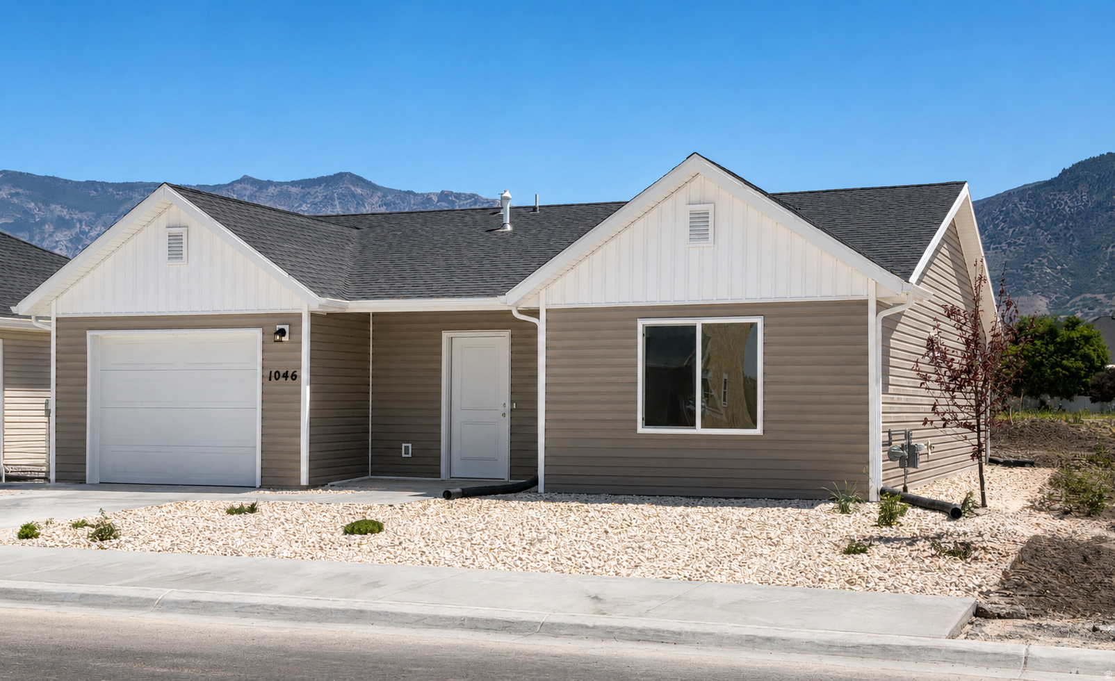 Refrigerator, Washer, and Dryer, included! This brand-new patio home offers the low-maintenance lifestyle buyers have been searching for without sacrificing quality, comfort, or location. Designed for easy single-level living, this thoughtfully crafted home features an open floor plan, quartz countertops, a walk-in closet, an attached garage with a smart opener, and beautiful mountain views right outside your door. Located in the highly desirable new community, you'll enjoy landscape maintenance done for you, along with walking trails, biking paths, parks, picnic areas, and pickleball courts. Whether you're downsizing, simplifying, or just tired of spending weekends on yard work, this is the lifestyle upgrade you've been waiting for. The best part? Everything is brand new. No outdated finishes. No expensive repairs. No projects waiting for you after closing. Just move in and enjoy. HOA Maintains -Pickleball Courts, Walking & Biking Trails, Open Green Space, Community Gathering Areas, Snow Removal, and Common Area Maintenance.