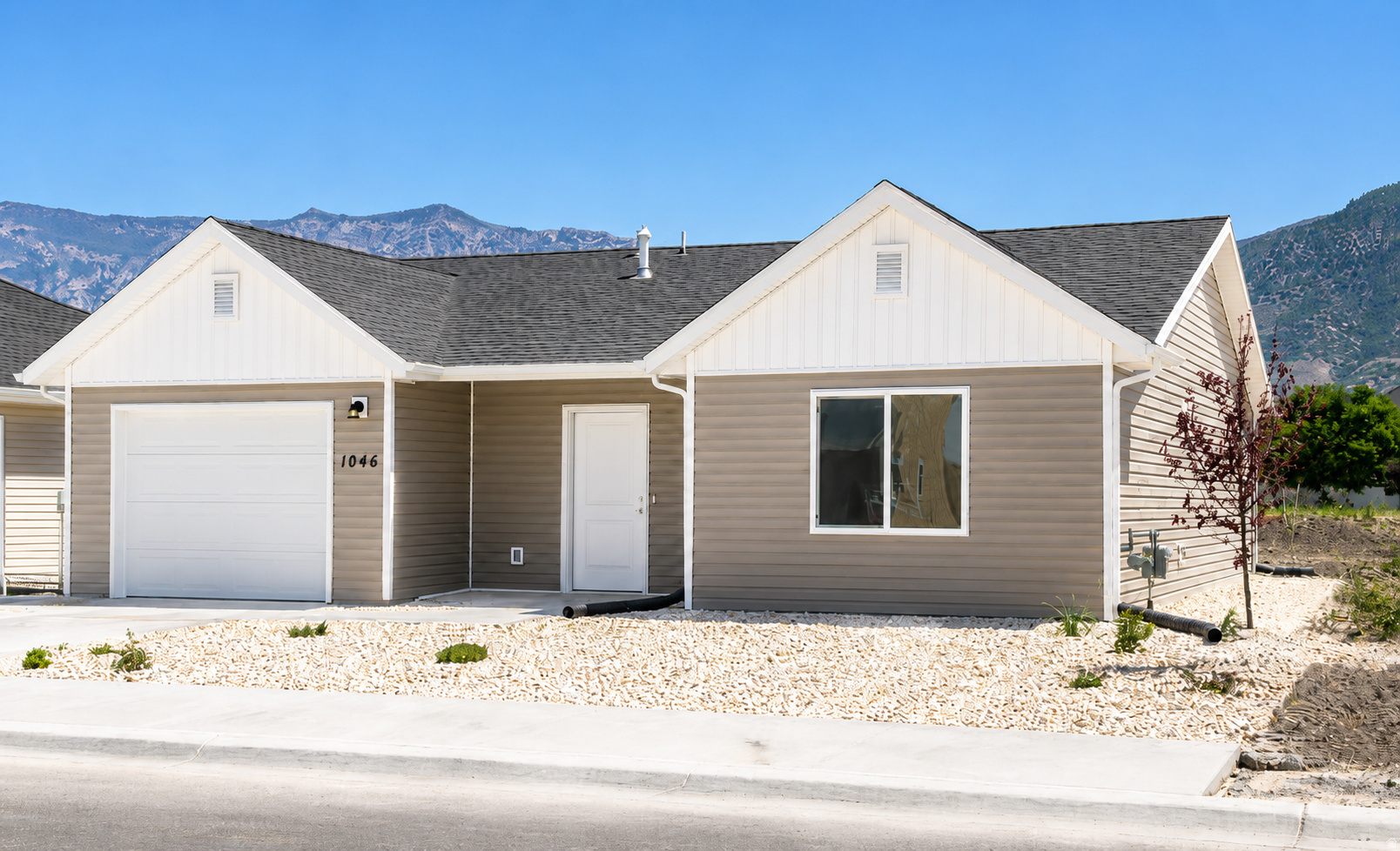 Refrigerator, Washer, and Dryer, included! This brand-new patio home offers the low-maintenance lifestyle buyers have been searching for without sacrificing quality, comfort, or location. Designed for easy single-level living, this thoughtfully crafted home features an open floor plan, quartz countertops, a walk-in closet, an attached garage with a smart opener, and beautiful mountain views right outside your door. Located in the highly desirable new community, you'll enjoy landscape maintenance done for you, along with walking trails, biking paths, parks, picnic areas, and pickleball courts. Whether you're downsizing, simplifying, or just tired of spending weekends on yard work, this is the lifestyle upgrade you've been waiting for. The best part? Everything is brand new. No outdated finishes. No expensive repairs. No projects waiting for you after closing. Just move in and enjoy. HOA Maintains -Pickleball Courts, Walking & Biking Trails, Open Green Space, Community Gathering Areas, Snow Removal, and Common Area Maintenance.