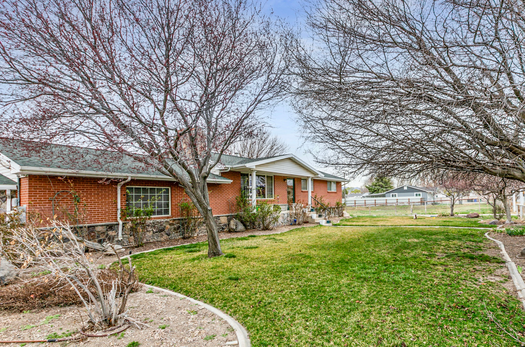 WOW! Country charm with city convenience! This unique property offers a rare opportunity with grandfathered zoning for up to 18 large animals, making it ideal for equestrian use, boarding, training, or simply enjoying the wide-open space. The existing 10-stall barn and pasture areas provide plenty of flexibility, featuring an existing arena or customize the setup to fit your vision. With 2 acres of ground the possibilities are truly endless. The home itself has been nicely updated with generously sized living spaces that feel both comfortable and functional. For those with an eye toward future development, the property also offers subdivision potential in a highly desirable, centrally located area-an excellent opportunity to create something special. Conveniently located near I-15, I-215, and Bangerter Highway, you'll love being right in the heart of the Salt Lake Valley while still enjoying a more open, country-style setting. All information provided as a courtesy-buyer to verify all details.
