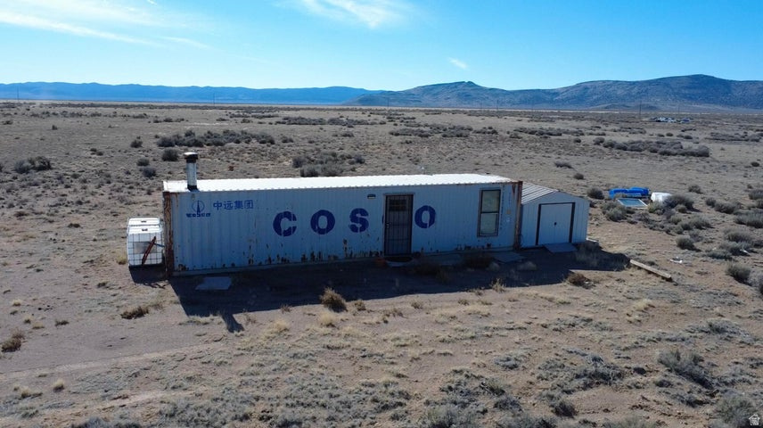 Unique off-grid opportunity on 2.27 acres in Beryl, UT featuring a converted 40ft container home with 1 bed, 1 bath-perfect for a weekend getaway, Airbnb investment, or full-time remote living. Powered by solar w/ 2 panels and 4 batteries, plus an existing septic system. Easy year-round access and close to Highway 56, with Dixie Power approximately 1,300 feet away. Enjoy breathtaking mountain and valley views, wide open space, and incredible night skies. Ideal for a family retreat, recreational basecamp, or primary off-grid residence. Bring your campers, RVs, trailers, and toys. Located about 30 minutes from Enterprise for gas, groceries, dining, and medical services, 30 minutes to Newcastle Reservoir for boating and fishing, and only 1 hour 10 minutes to St. George and Cedar City.