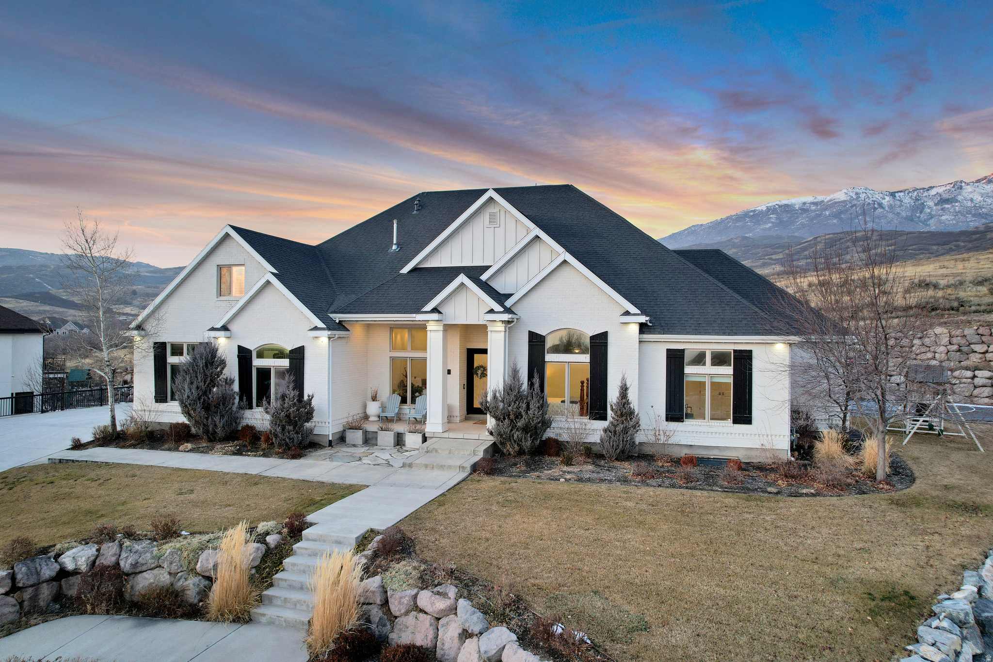 Located at the top of the Twin Bridges subdivision, this home offers stunning mountain views, exceptional privacy, surrounded by nearby parks and trails. As you step inside, you are welcomed by a well-balanced, easy-flow floor plan with high ceilings throughout creating a bright, open atmosphere filled with natural light. The recently updated kitchen is designed for both everyday living and entertaining, featuring custom cabinetry, dual islands, and a built-in bake center seamlessly integrated into the island. The main-level primary suite provides the convenience of single-level living and includes dual full size walk-in closets. Downstairs, the basement features 9.5-foot ceilings, a separate entrance, ample storage, plumbing for a second kitchen, and an additional laundry room, offering flexibility for guest space, multi-generational living, and the perfect space to host family and friends. A dedicated home theater and loft area add even more functional living space. Additional highlights include a heated driveway, abundant storage throughout, and a private backyard complete with a sports/pickleball court and swim spa. Thoughtful updates and a versatile layout make this home as functional as it is inviting. Buyer/Buyer's Agent to verify all information.